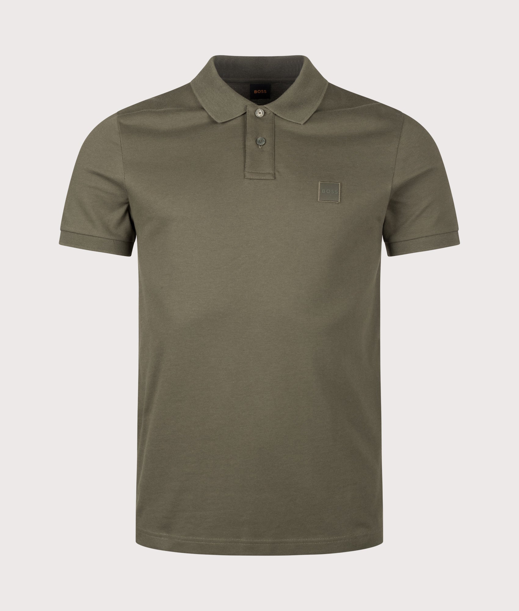 BOSS Slim Fit Passenger Polo Shirt in Bright Green at EQVVS Menswear. Front shot.