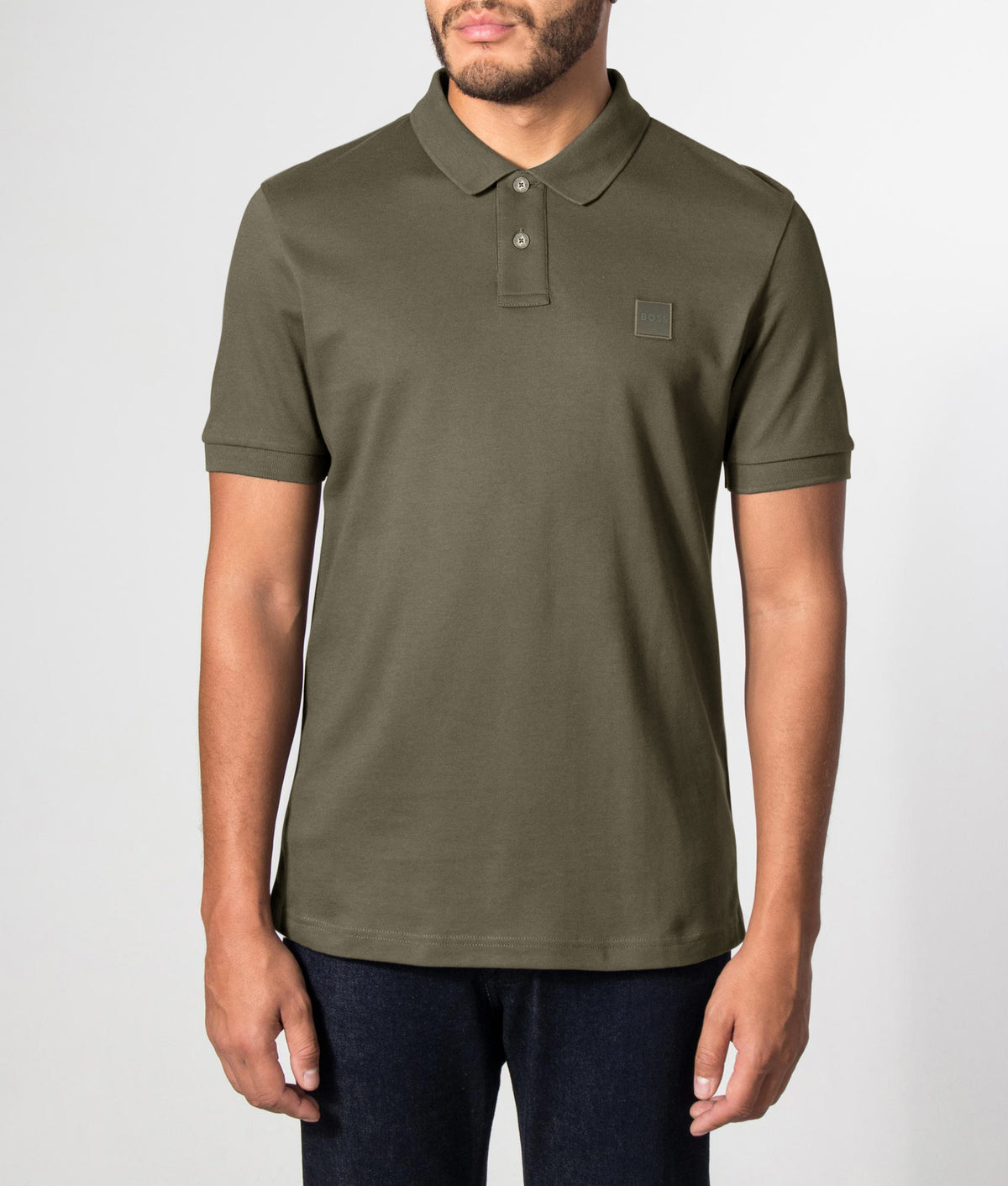 BOSS Slim Fit Passenger Polo Shirt in Bright Green at EQVVS Menswear. Front model shot.