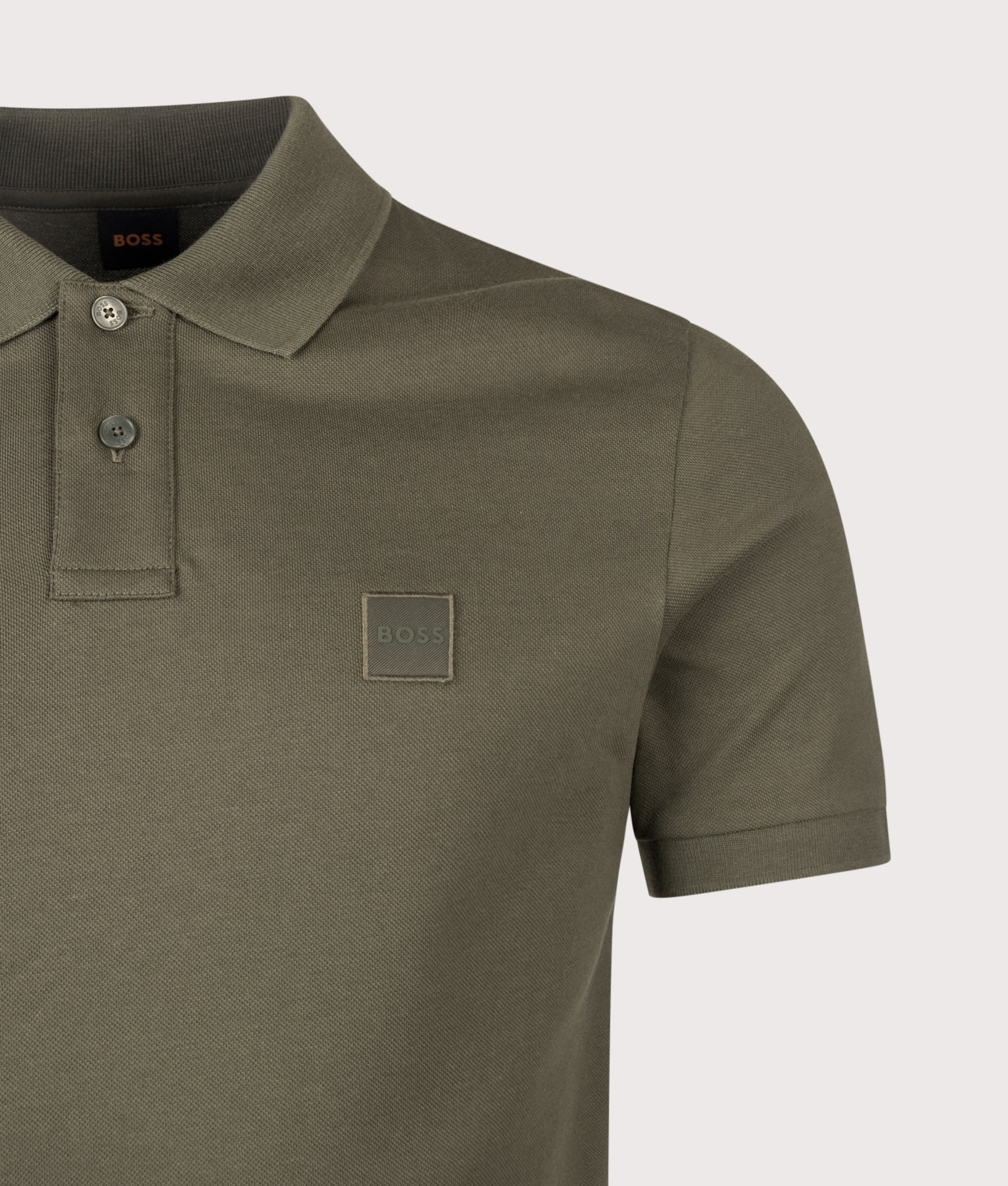 BOSS Slim Fit Passenger Polo Shirt in Bright Green at EQVVS Menswear. Detail shot.