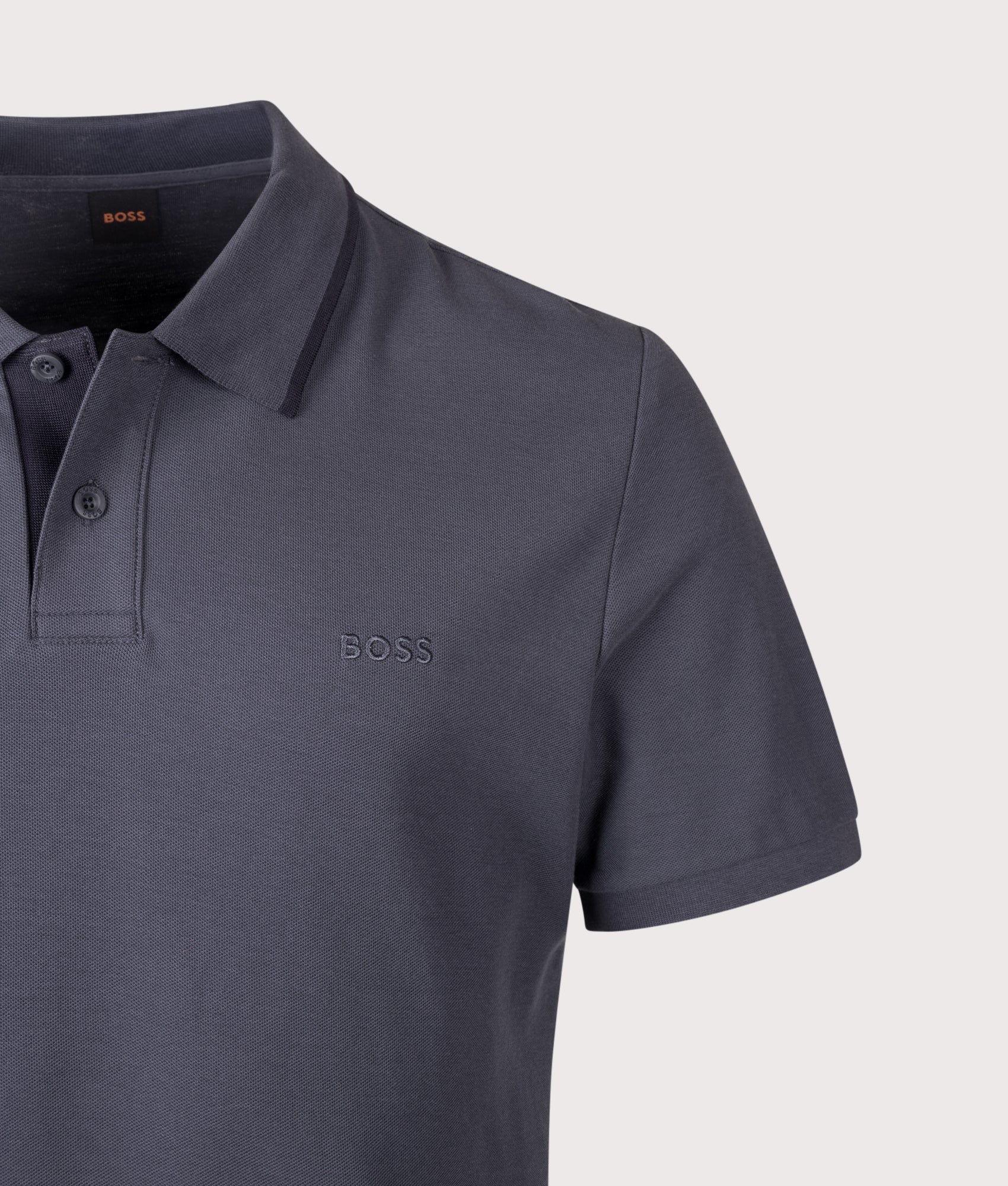 BOSS Regular Fit Phoenix Polo Shirt in Dark Blue at EQVVS Menswear. Detail shot.