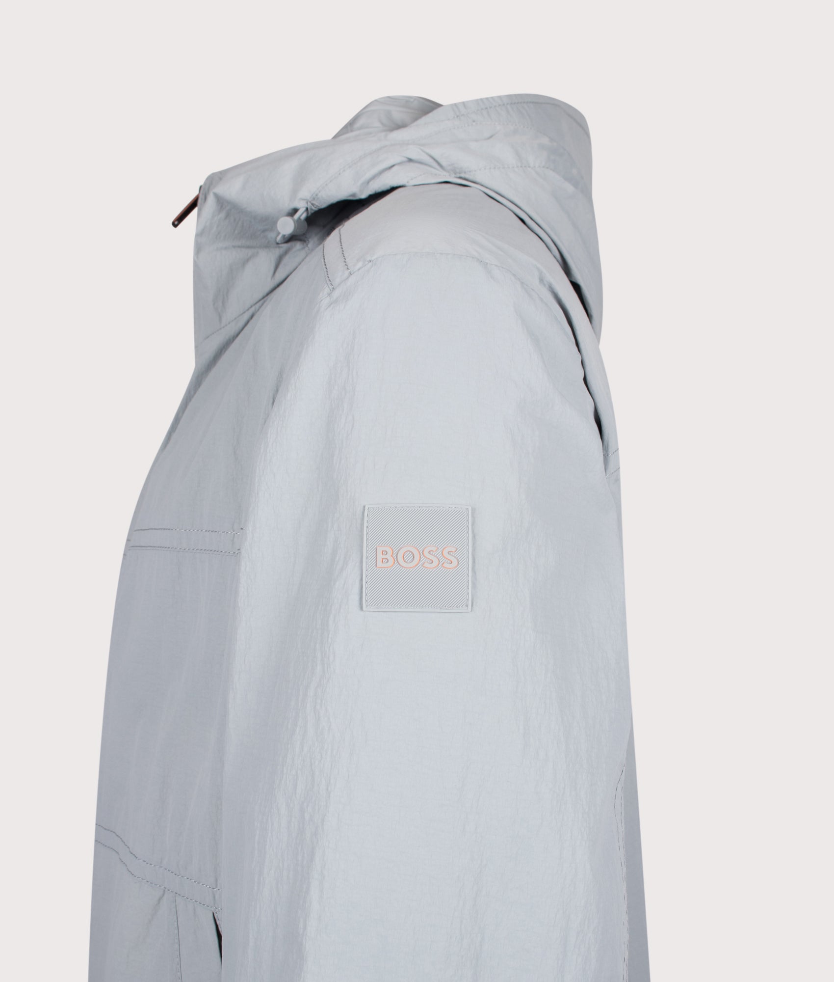 BOSS Relaxed Fit Otily1 Windbreaker Jacket in Open Grey at EQVVS Menswear. Detail shot.