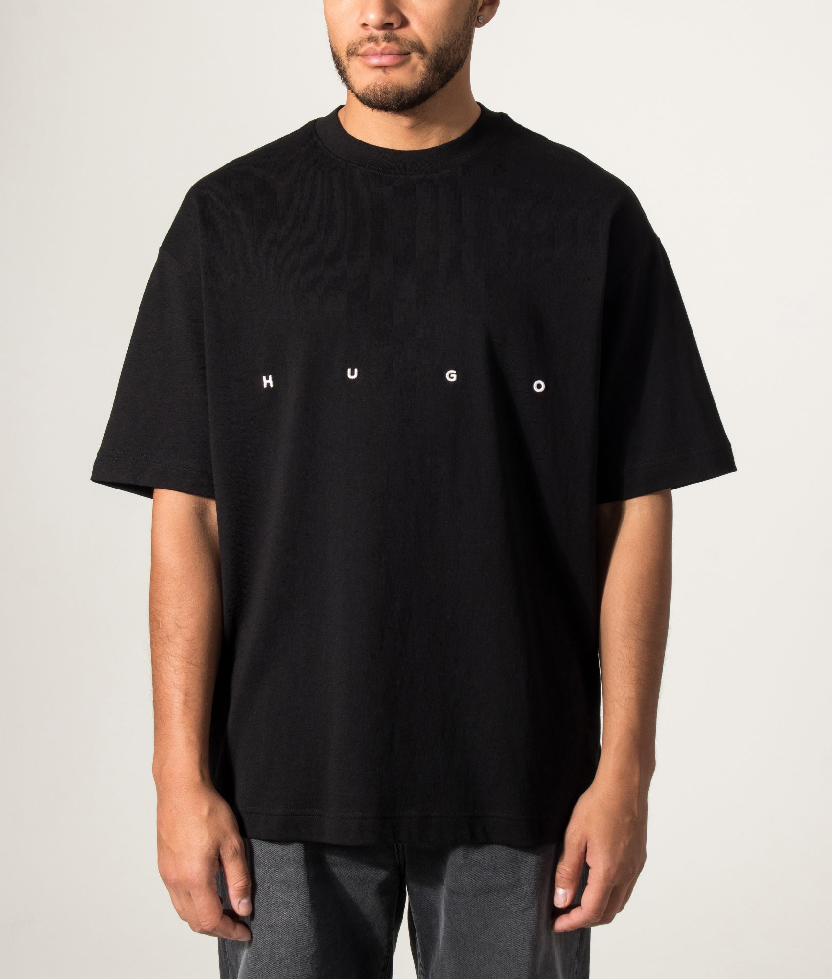 HUGO Oversized Dariso T-Shirt in Black  at EQVVS Menswear. Model front shot.