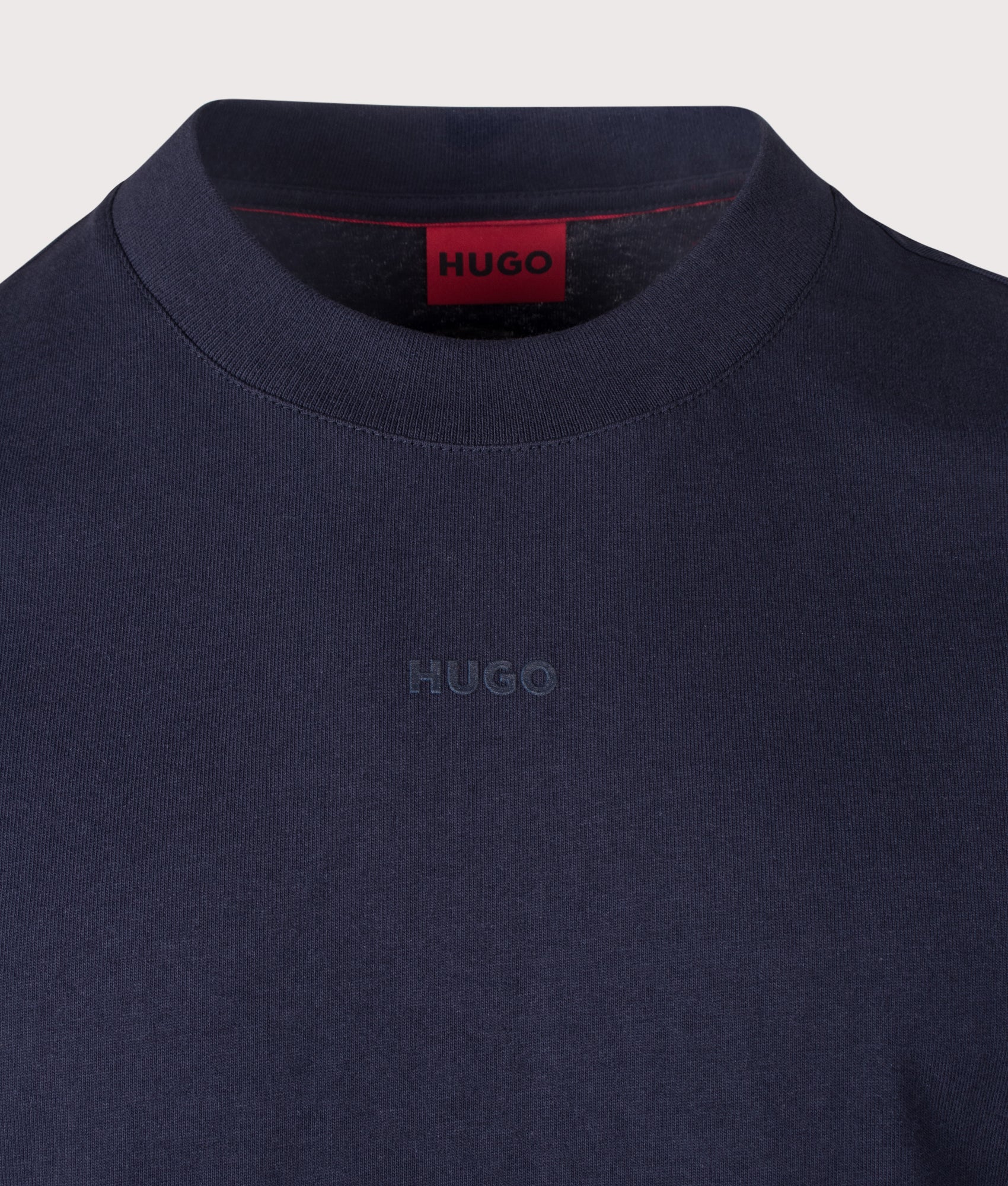 HUGO Relaxed Fit Dapolino T-Shirt in Dark Blue at EQVVS Menswear. Detail shot.