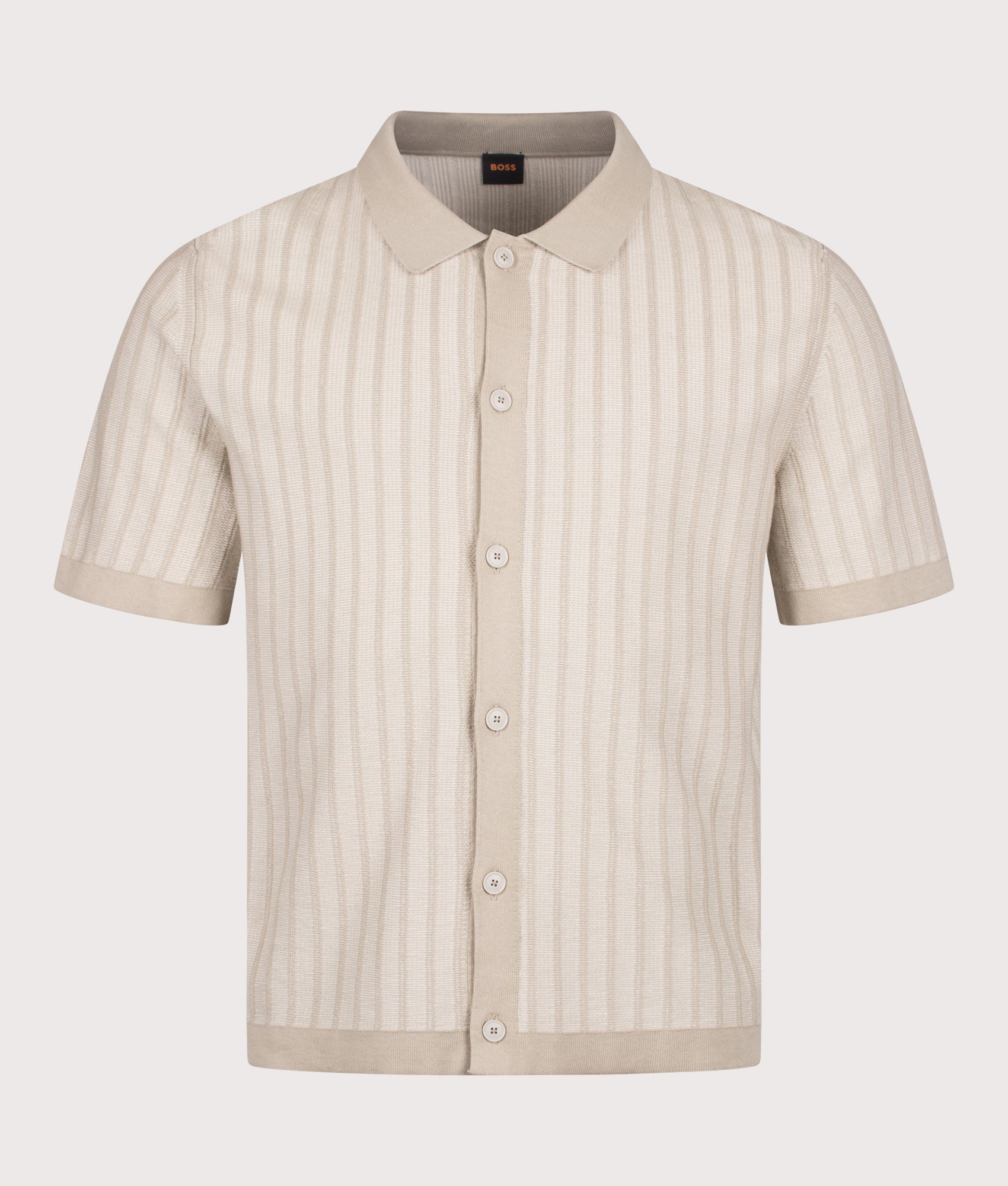BOSS Relaxed Fit Kodd Knitted Polo Shirt in Light Beige at EQVVS Menswear. Front shot.