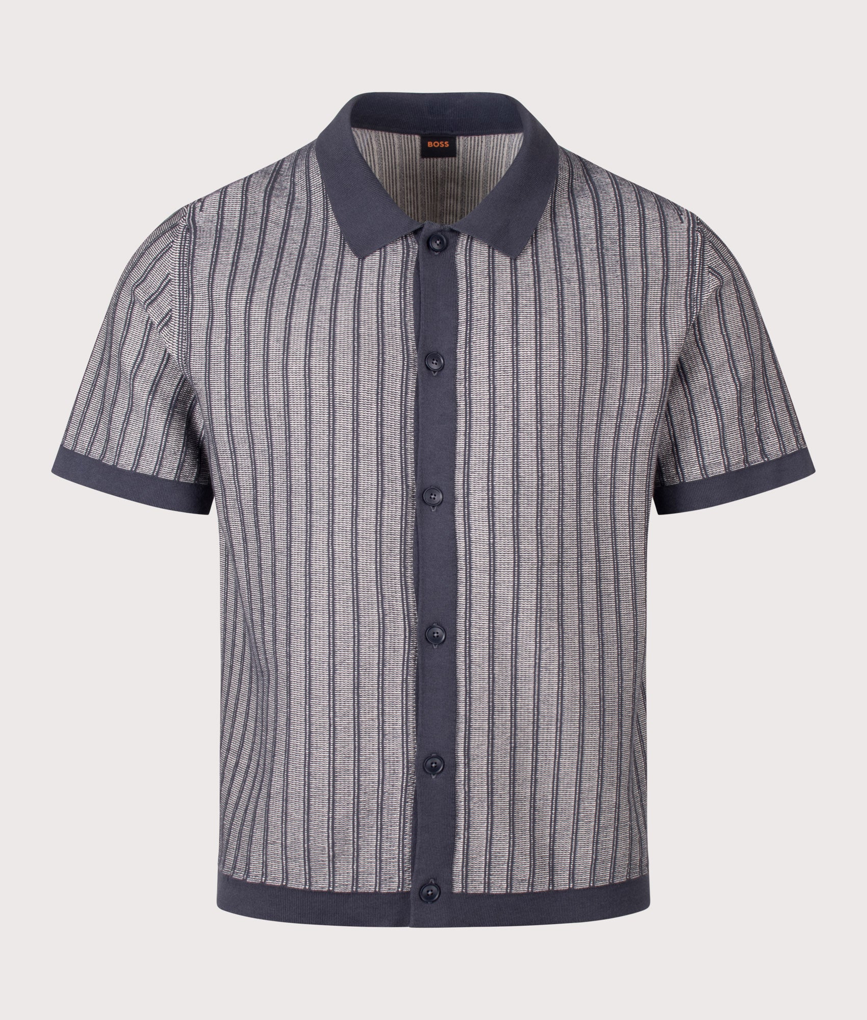 BOSS Relaxed Fit Kodd Knitted Polo Shirt in Dark Blue at EQVVS Menswear. Front shot.