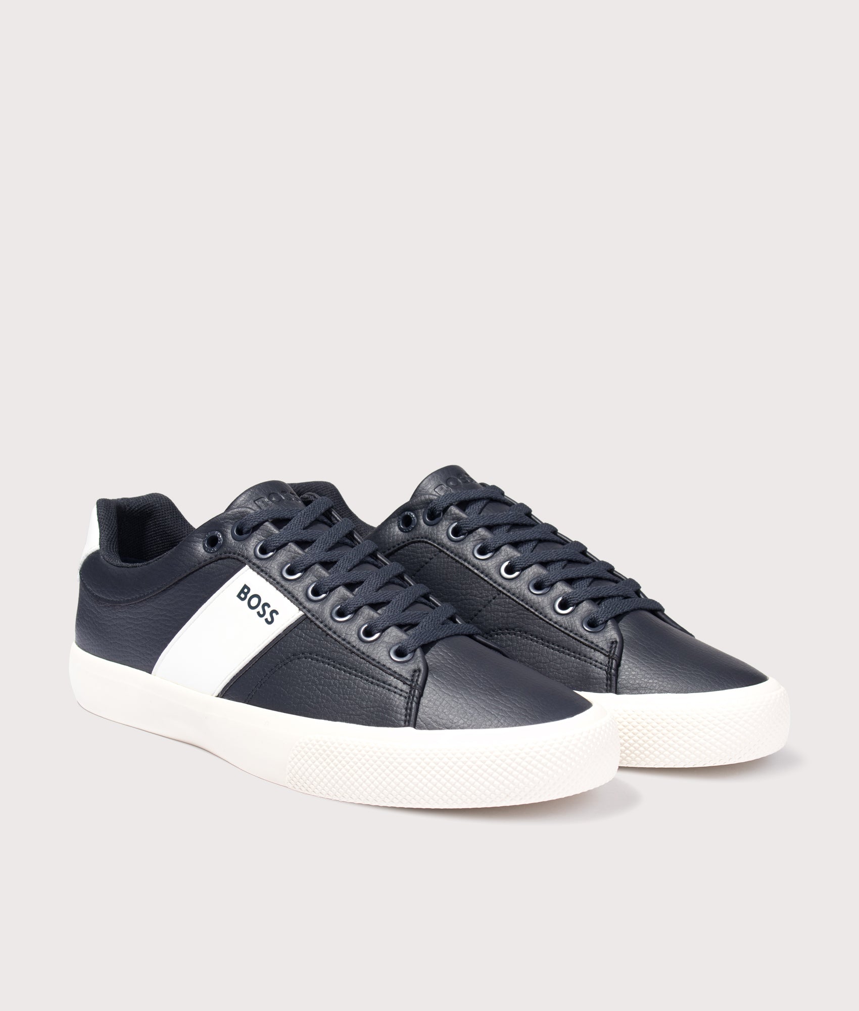 BOSS Aiden Tenn Trainers in Navy at EQVVS Menswear. Angled front shot.