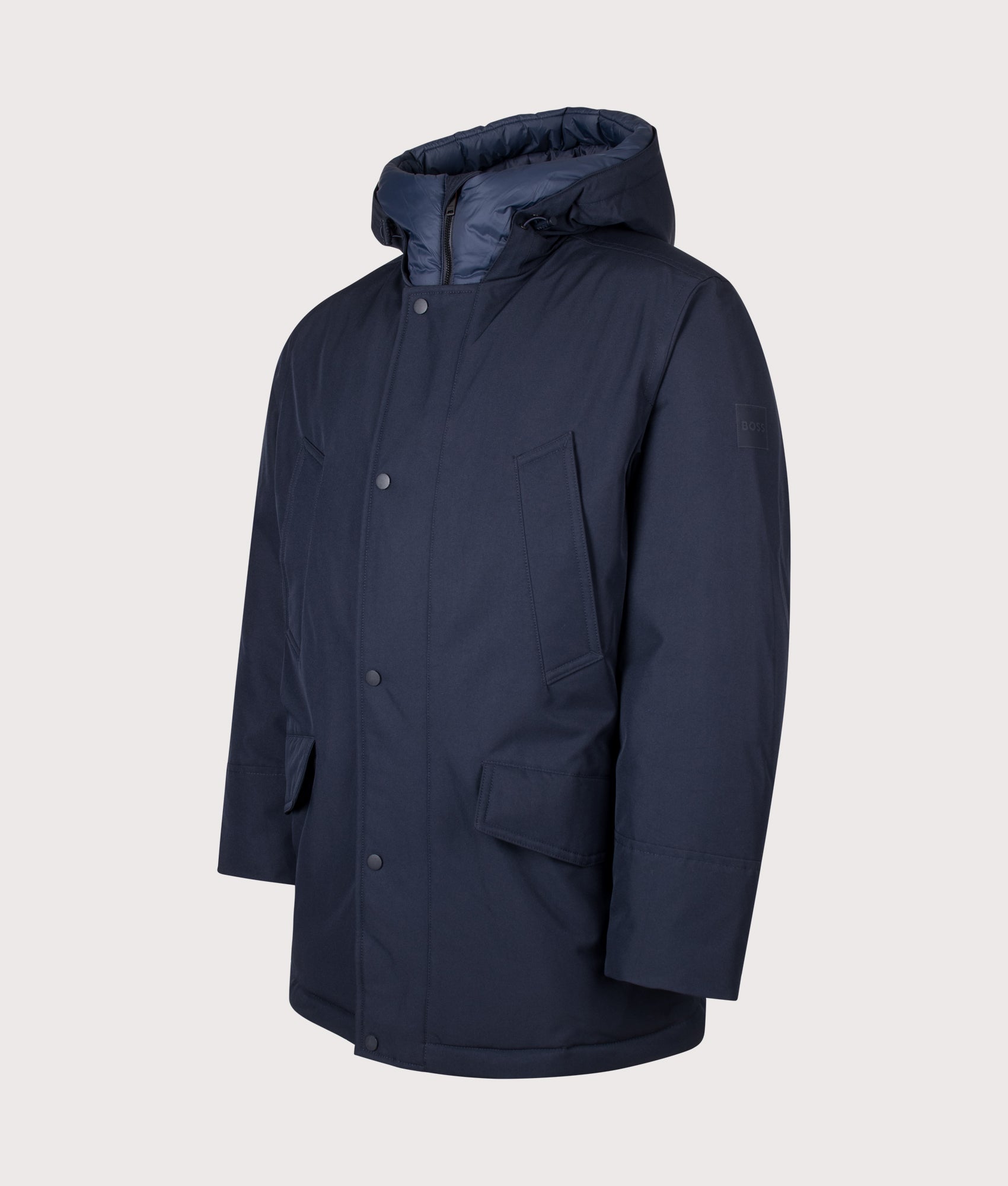 BOSS Regular Fit Osiass1 Parka in Dark Blue at EQVVS Menswear. Angled front shot.