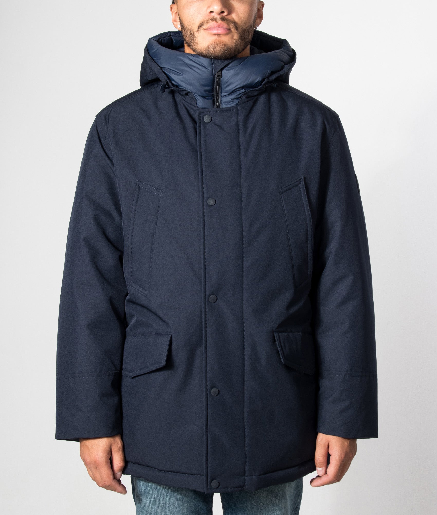 BOSS Regular Fit Osiass1 Parka in Dark Blue at EQVVS Menswear. Model front shot.