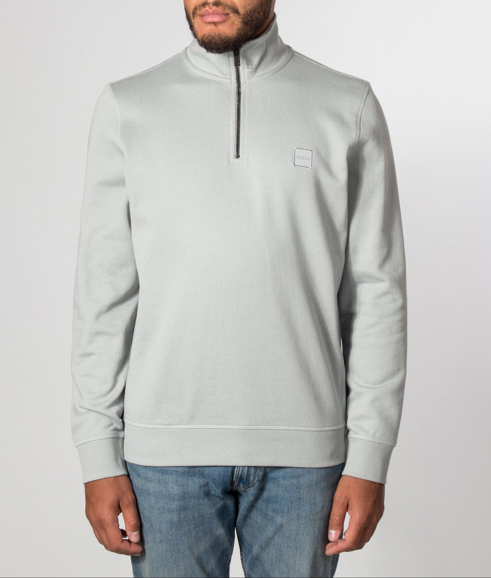 BOSS Zetrust Quarter Zip Sweatshirt in Open Grey at EQVVS Menswear. Model front shot.