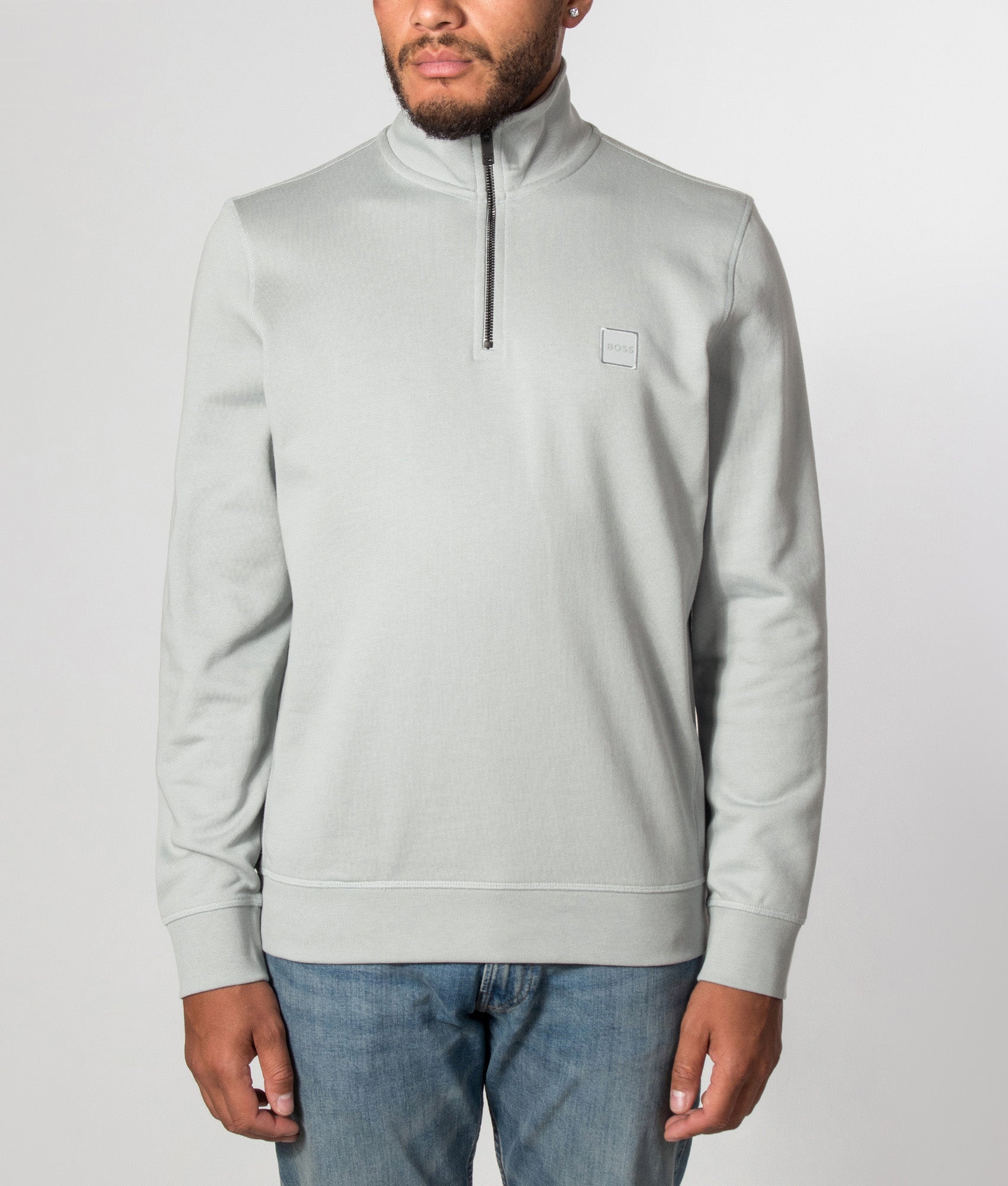 BOSS Zetrust Quarter Zip Sweatshirt in Open Grey at EQVVS Menswear. Model front shot.