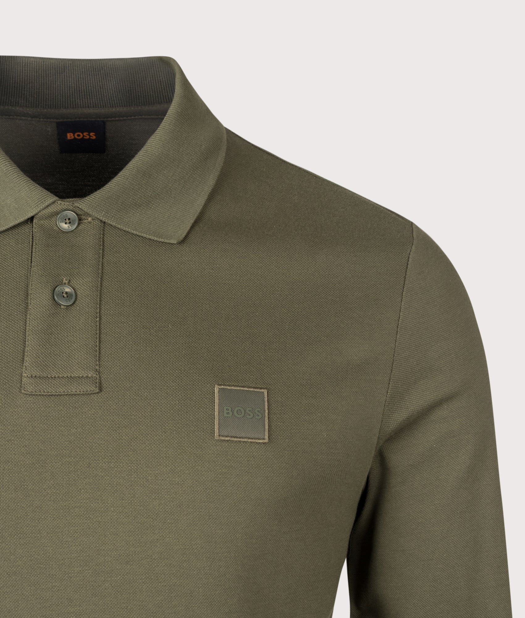 BOSS Slim Fit Passerby Long Sleeve Polo Shirt in Bright Green at EQVVS Menswear. Detail shot.