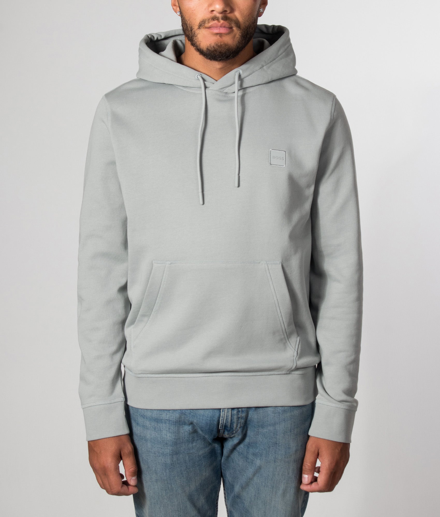 BOSS Wetalk Hoodie in Open Grey at EQVVS Menswear. Model front shot.