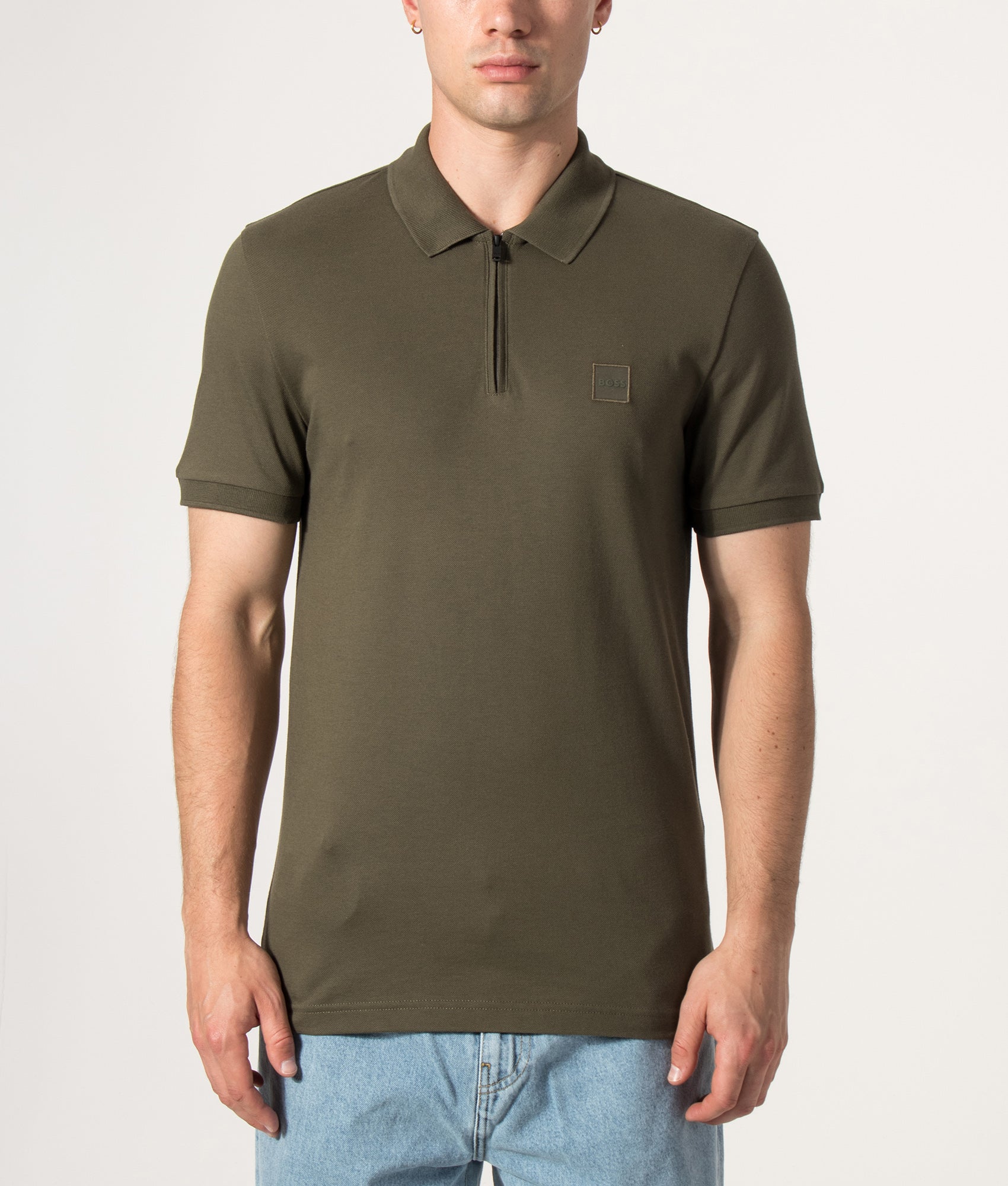 BOSS Slim Fit Passerzip Polo Shirt in Bright Green at EQVVS Menswear. Model front shot.