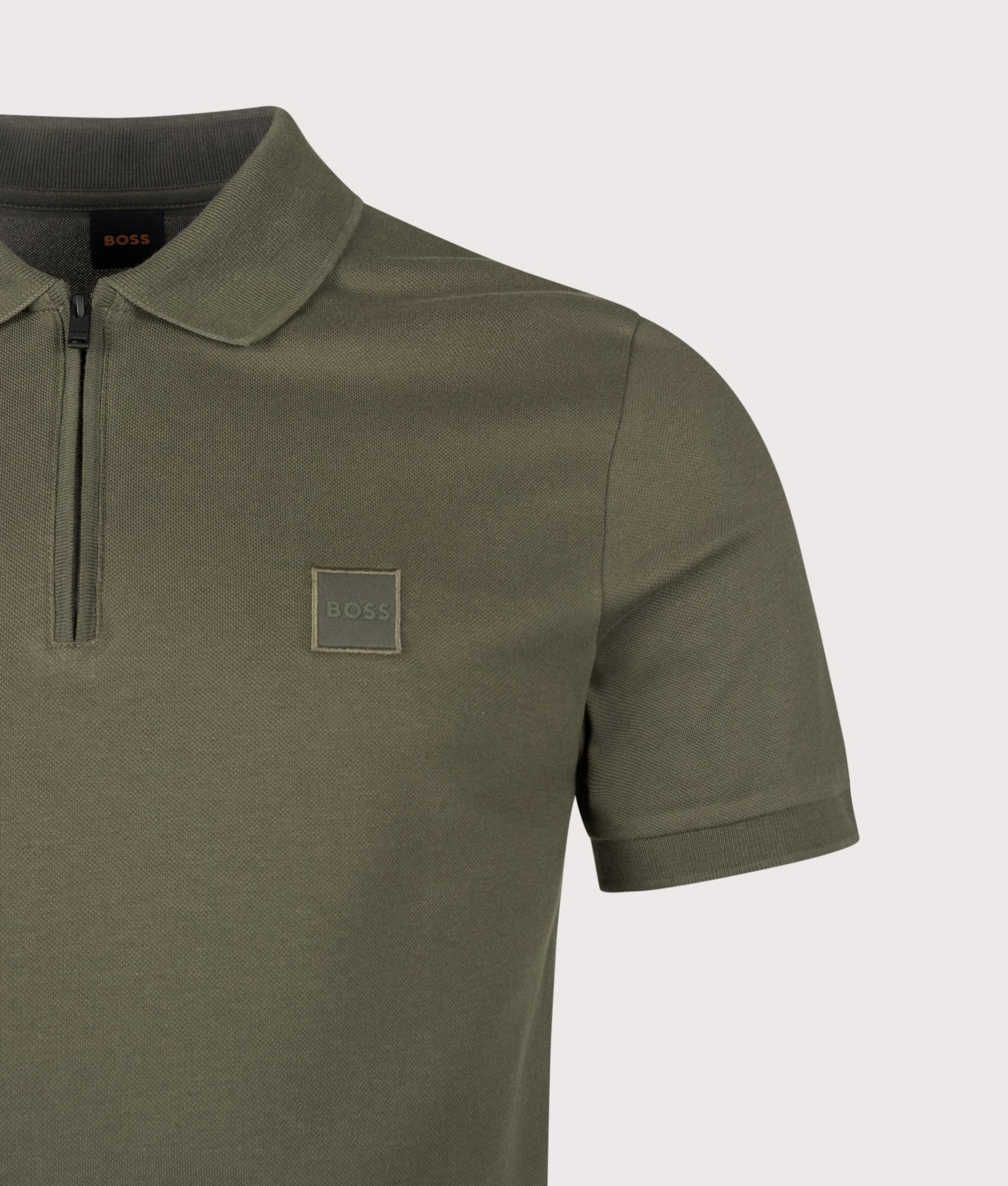 BOSS Slim Fit Passerzip Polo Shirt in Bright Green at EQVVS Menswear. Detail shot.
