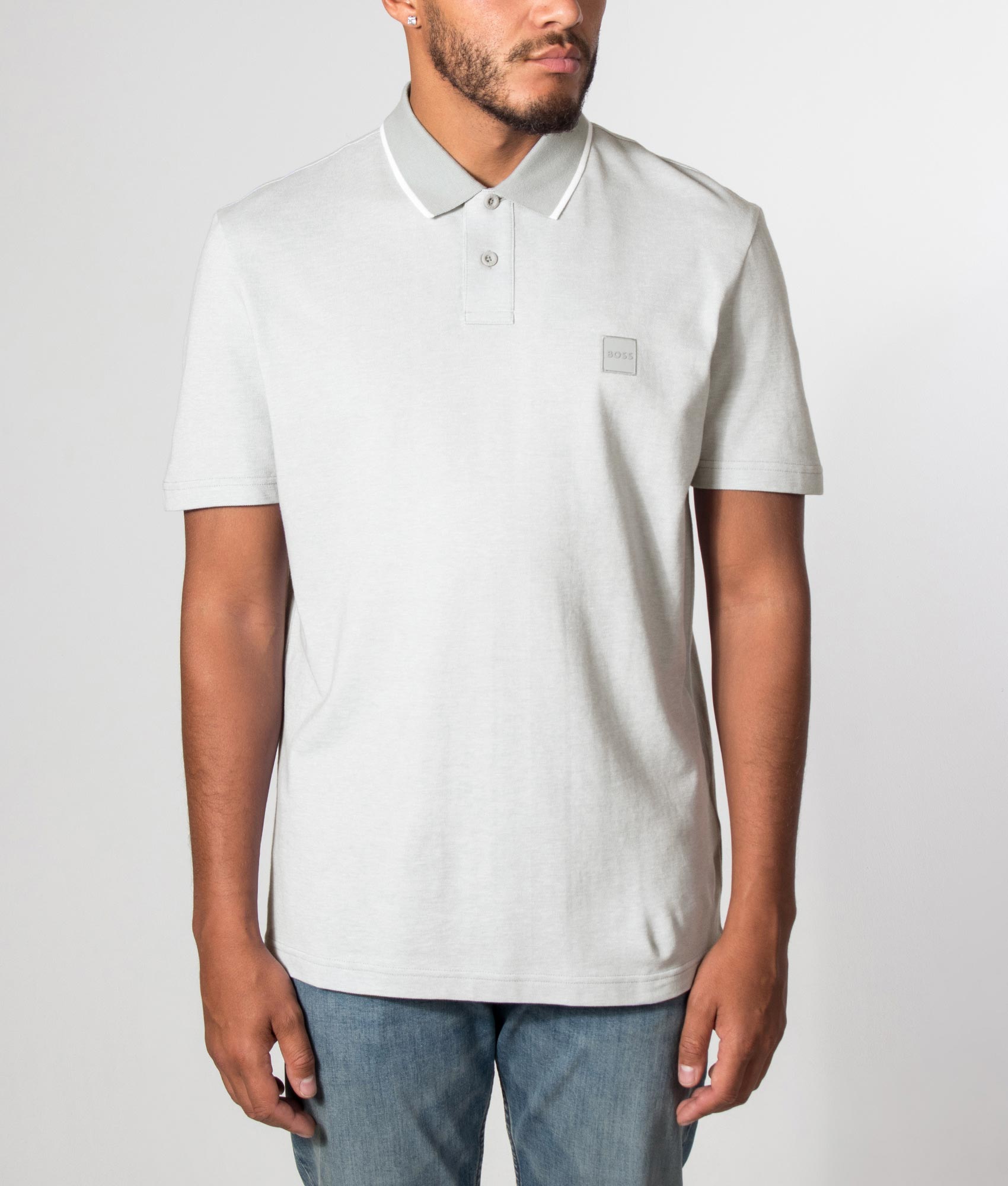 BOSS Regular Fit Passerford Polo Shirt in Open Grey at EQVVS Menswear. Model front shot.