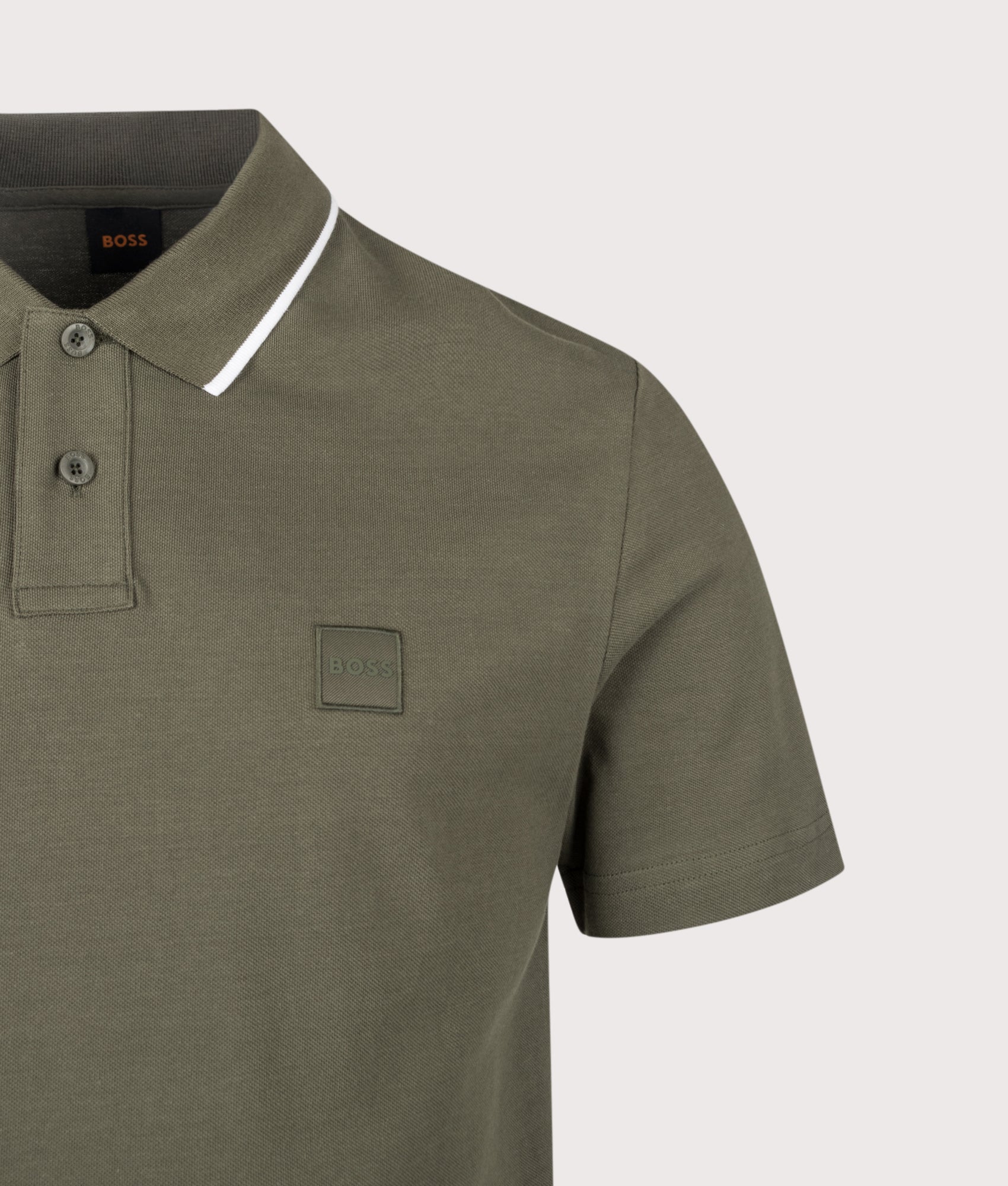 BOSS Passerford Polo Shirt in Bright Green at EQVVS Menswear. Detail shot.