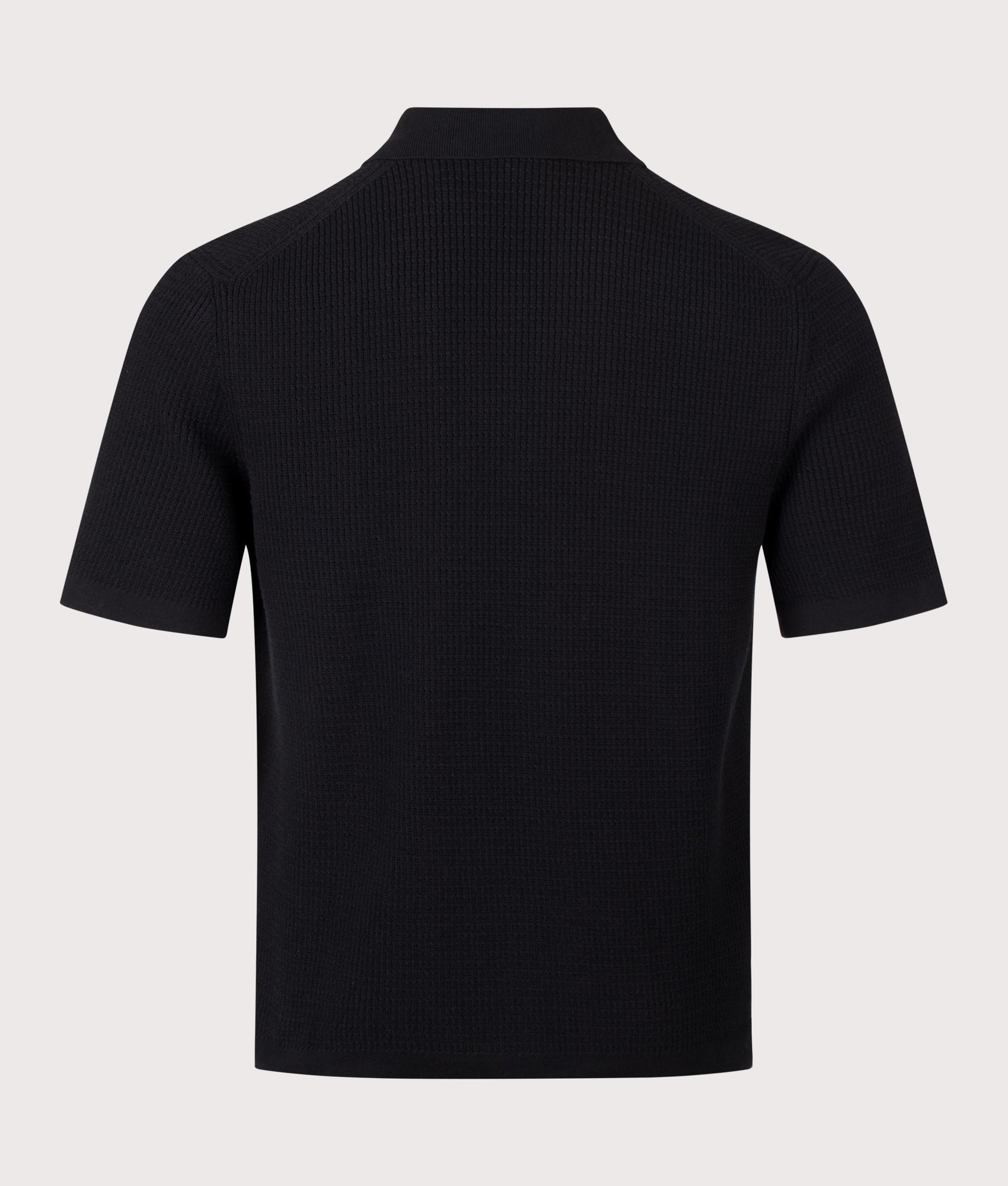 BOSS Relaxed Fit Akepalo Knitted Polo Shirt in Black at EQVVS Menswear. Back shot.