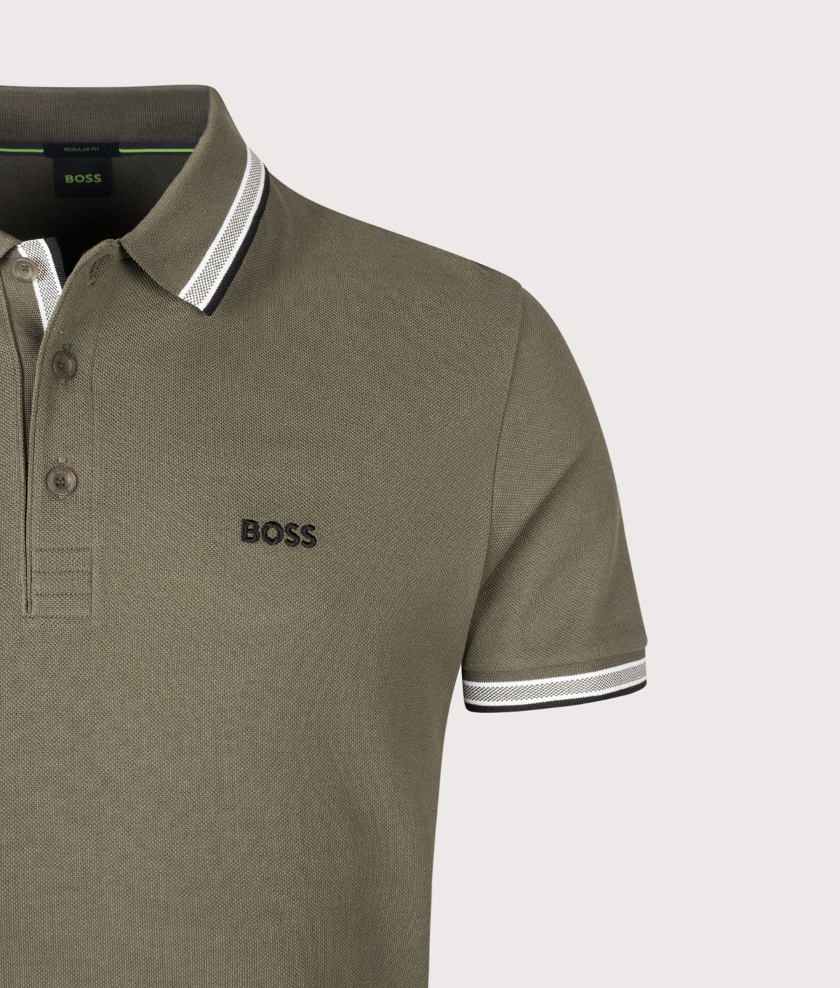 BOSS Regular Fit Paddy Polo Shirt in Open Green at EQVVS Menswear. Detail shot.