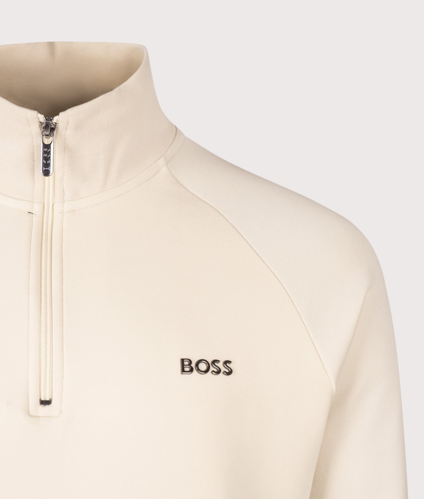 BOSS Regular Fit Sense Quarter Zip Sweatshirt in Open White at EQVVS Menswear. Detail shot.