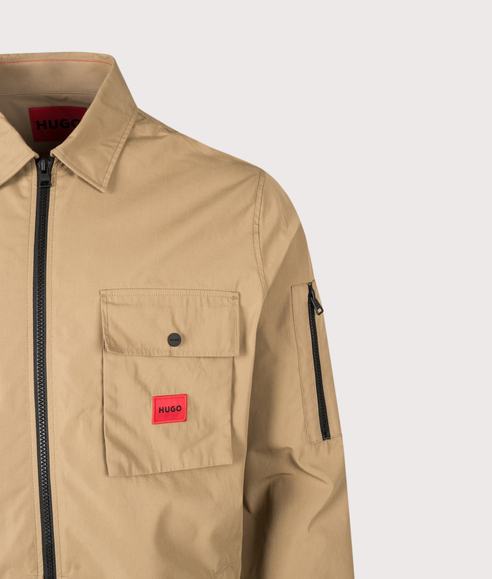 HUGO Relaxed Fit Emmond Zip Through Overshirt in Beige Overflow at EQVVS Menswear. Detail shot.