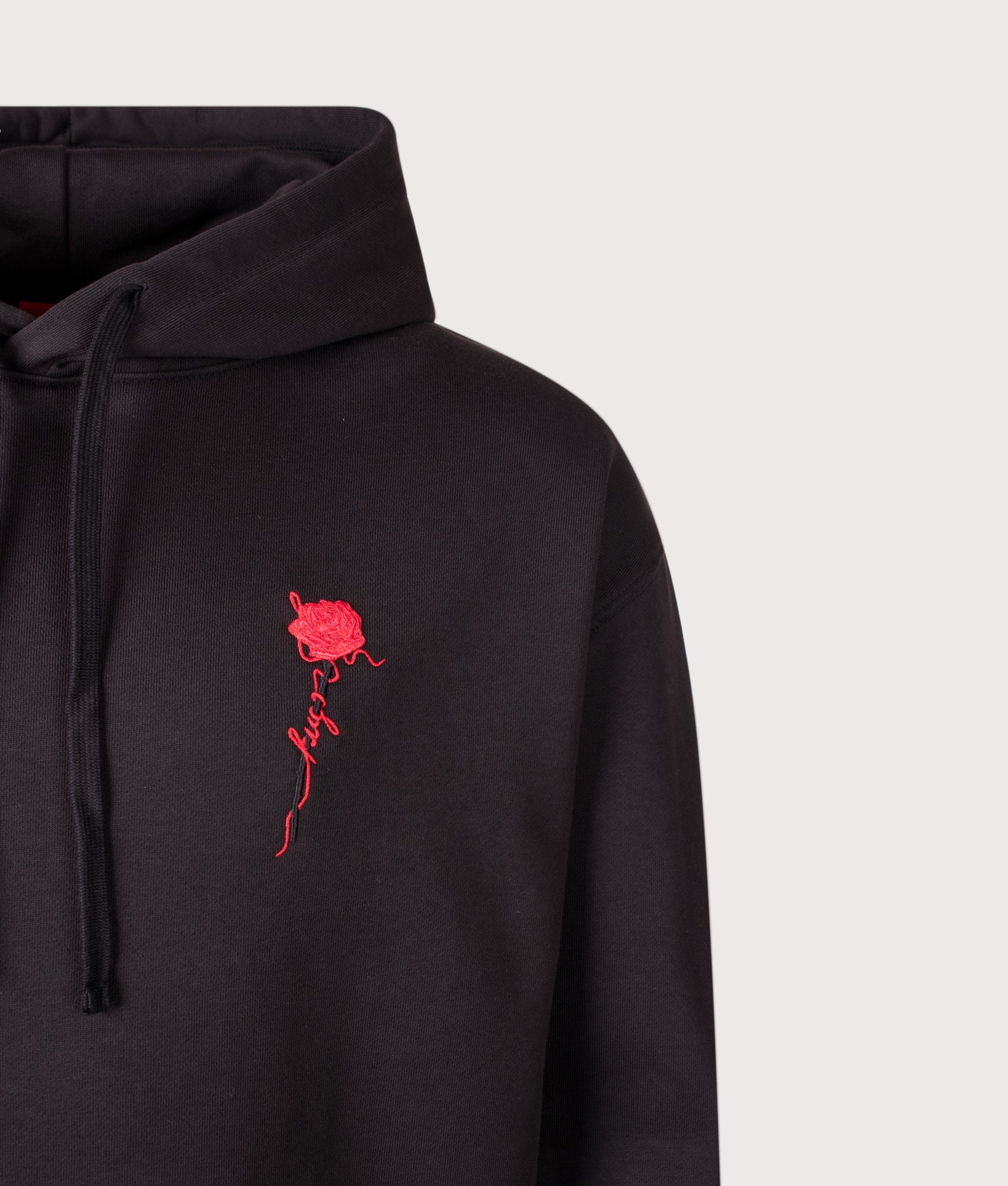 HUGO Relaxed Fit Diflow Hoodie in Black at EQVVS Menswear. Detail shot.