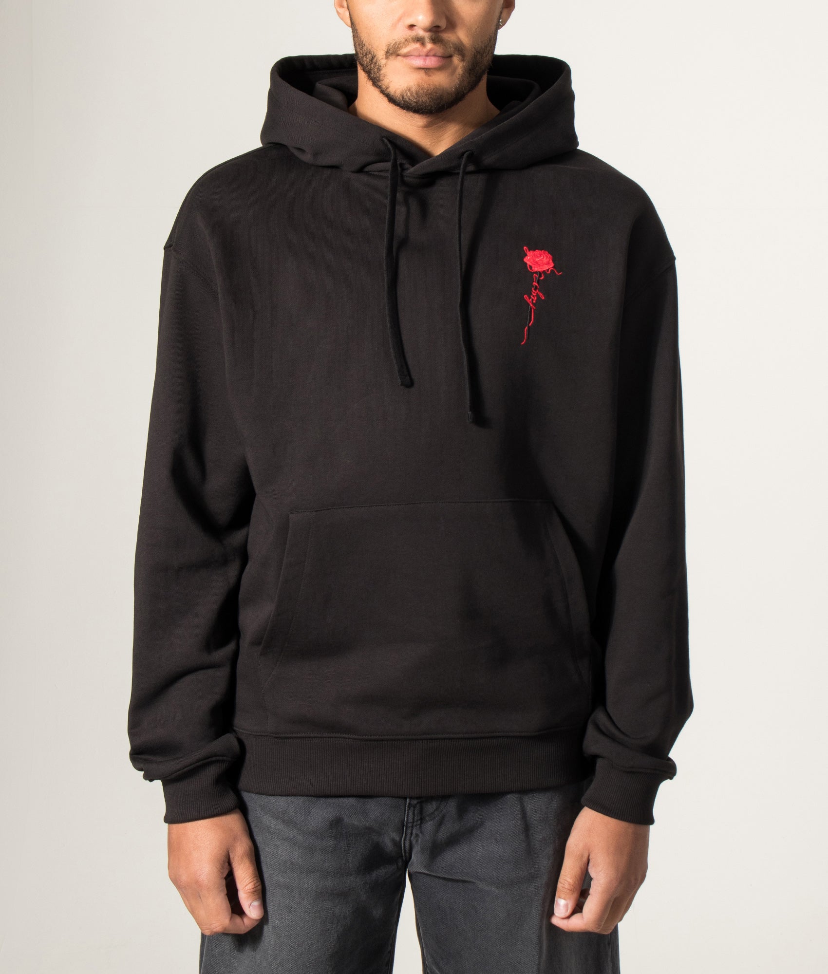HUGO Relaxed Fit Diflow Hoodie in Black at EQVVS Menswear. Model front shot.