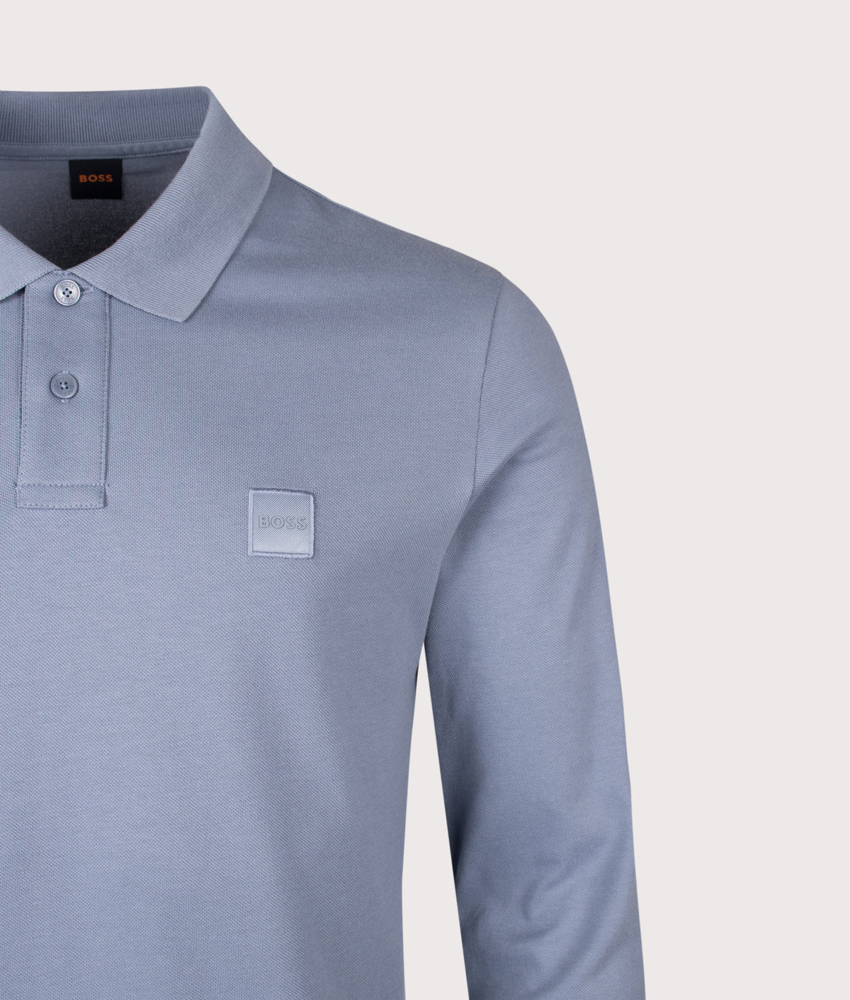 BOSS Slim Fit Passerby Long Sleeve Polo Shirt in Medium Blue at EQVVS Menswear. Detail shot.