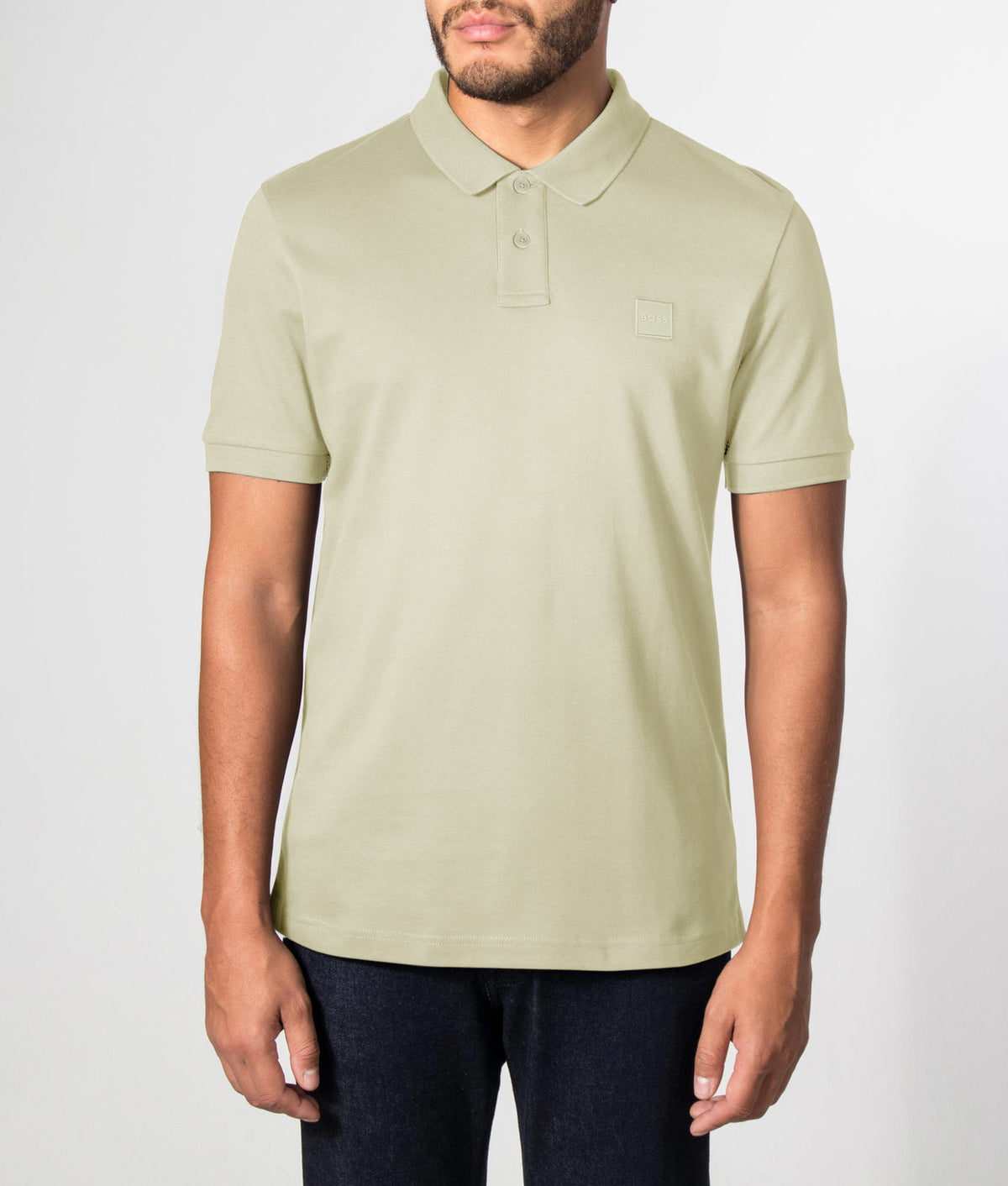 BOSS Slim Fit Passenger Polo Shirt in Open Green at EQVVS Menswear. Front model shot.