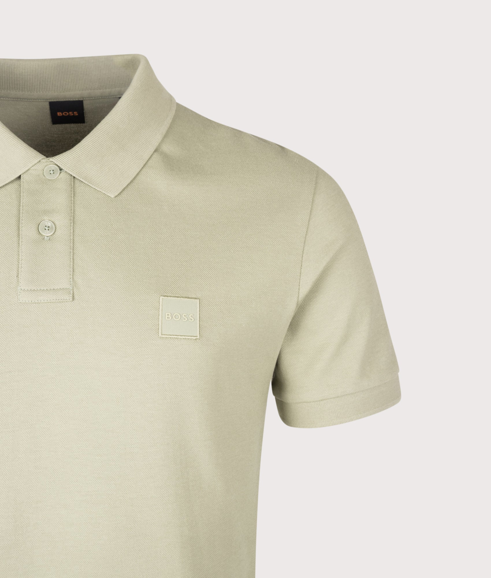 BOSS Slim Fit Passenger Polo Shirt in Open Green at EQVVS Menswear. Detail shot.