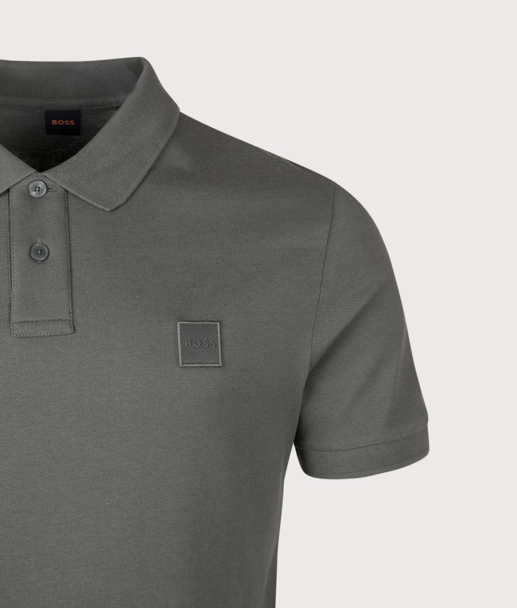 BOSS Slim Fit Passenger Polo Shirt in Open Green at EQVVS Menswear. Detail shot.