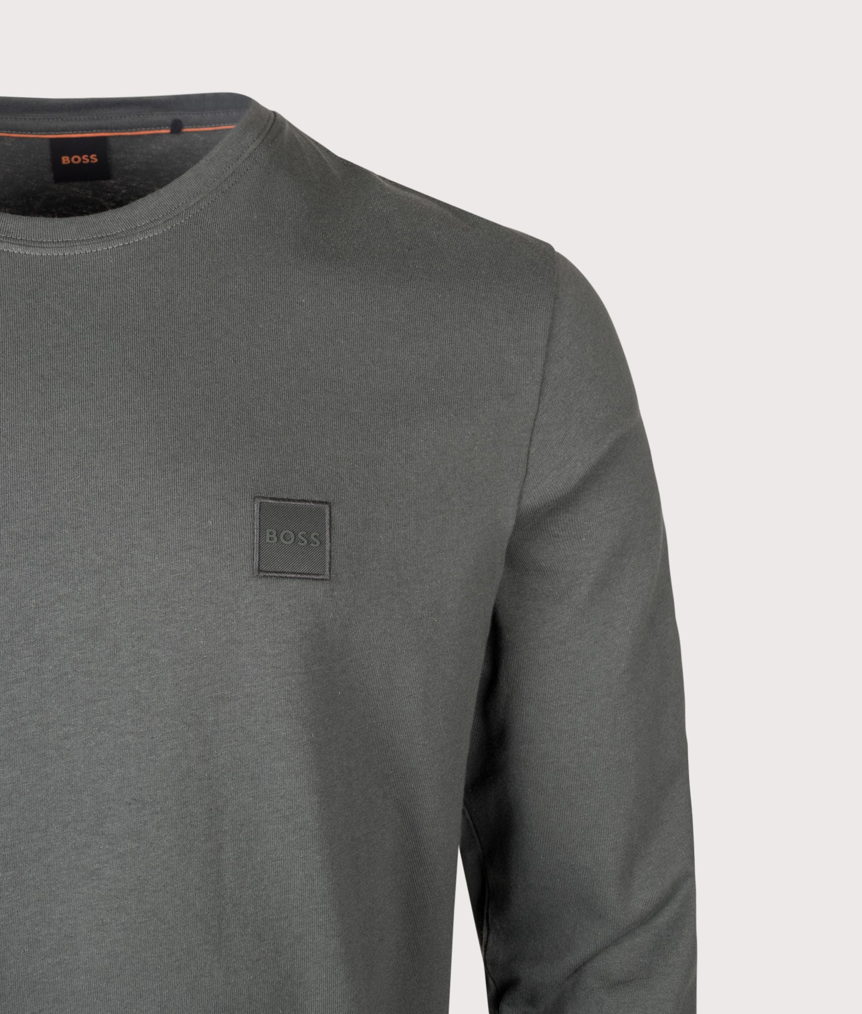 BOSS Regular Fit Long Sleeve Tacks T-Shirt in Open Green at EQVVS Menswear. Detail shot.