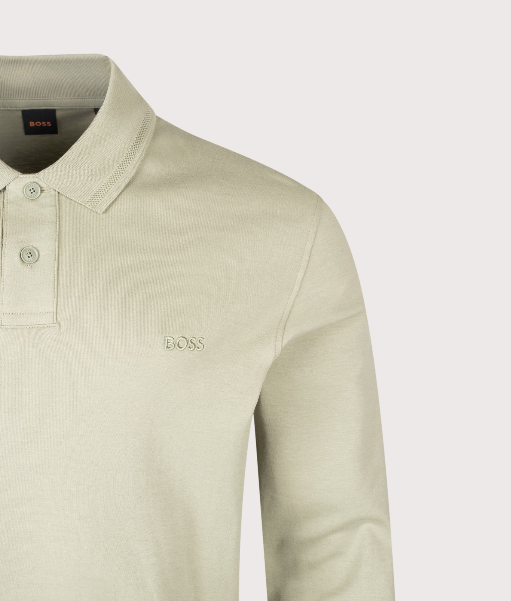 BOSS Regular Fit Piqué Interlock Long Sleeve Polo Shirt in Open Green at EQVVS Menswear. Detail shot.