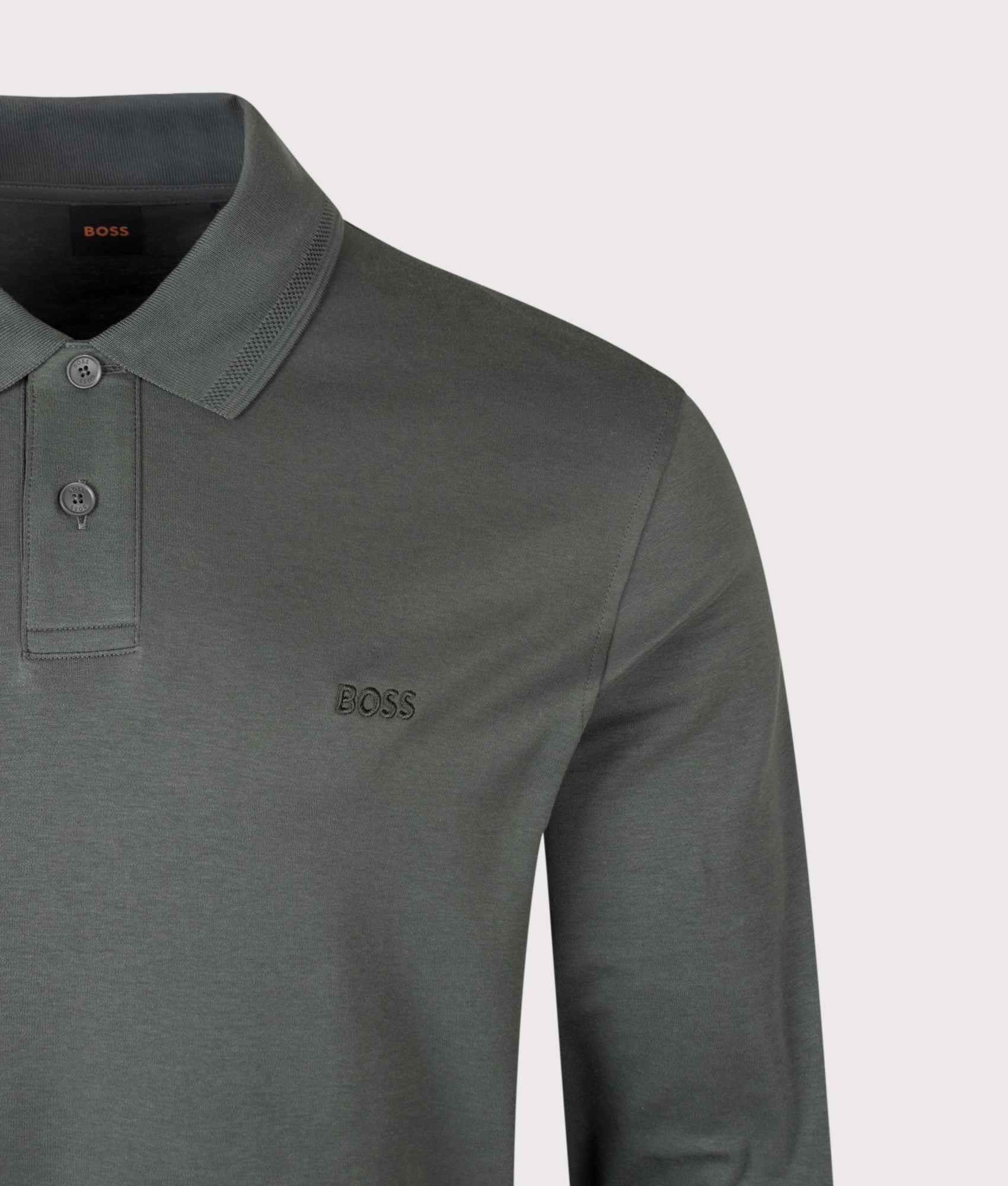 BOSS Regular Fit Piqué Interlock Long Sleeve Polo Shirt in Open Green at EQVVS Menswear. Detail shot.