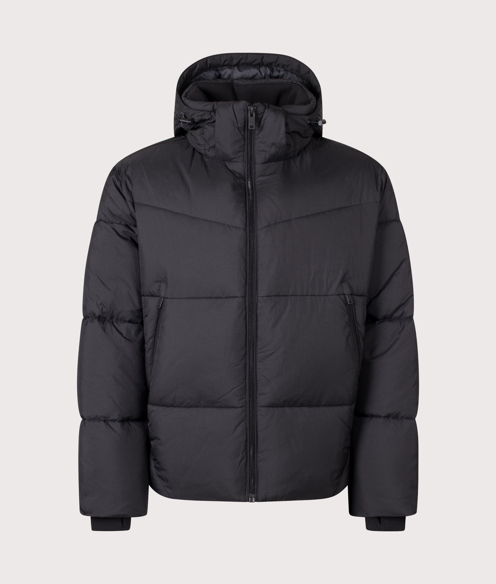 BOSS Oversized Fit Obore Puffer Jacket in Black at EQVVS Menswear. Front shot.