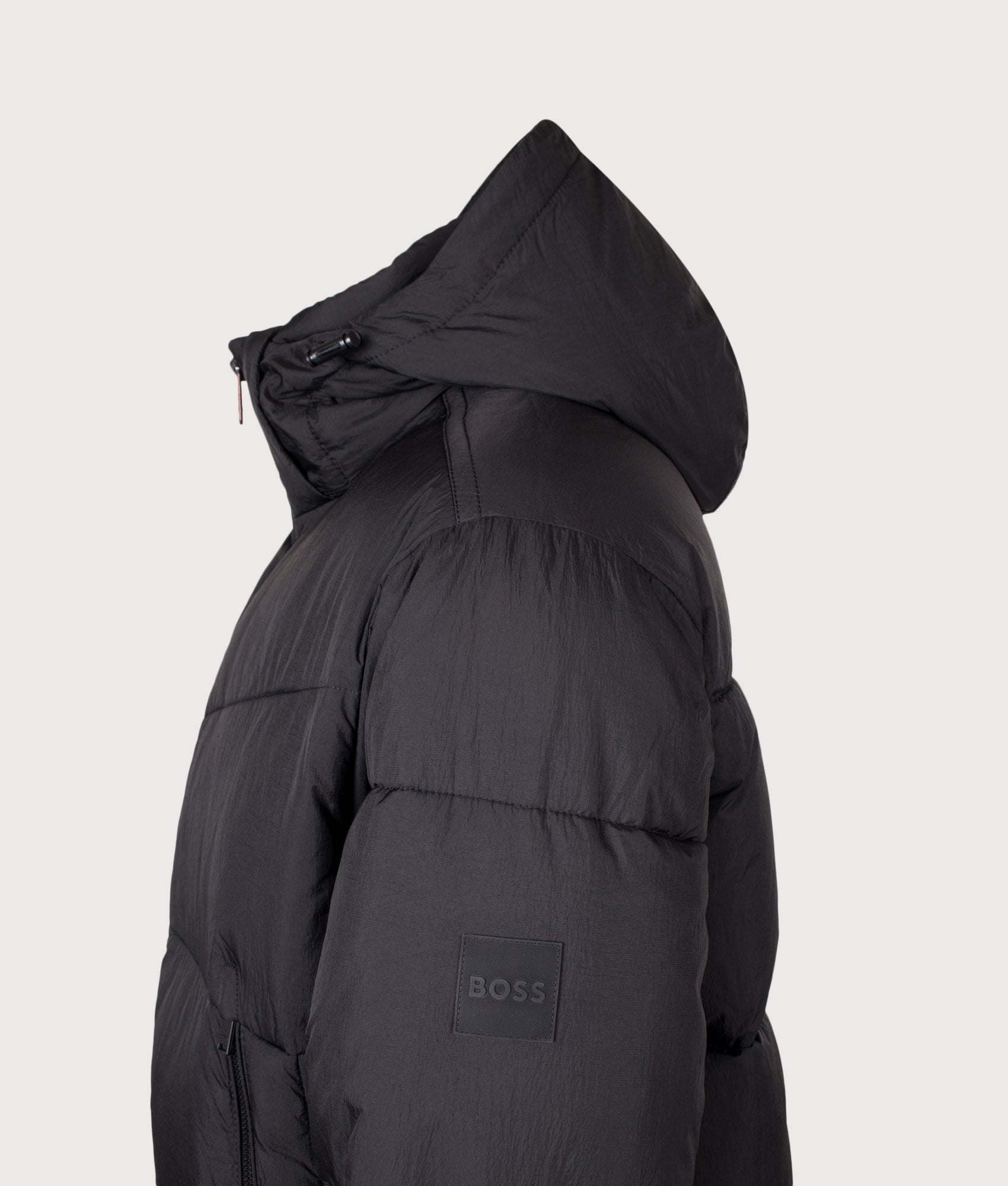 BOSS Oversized Fit Obore Puffer Jacket in Black at EQVVS Menswear. Detail shot.