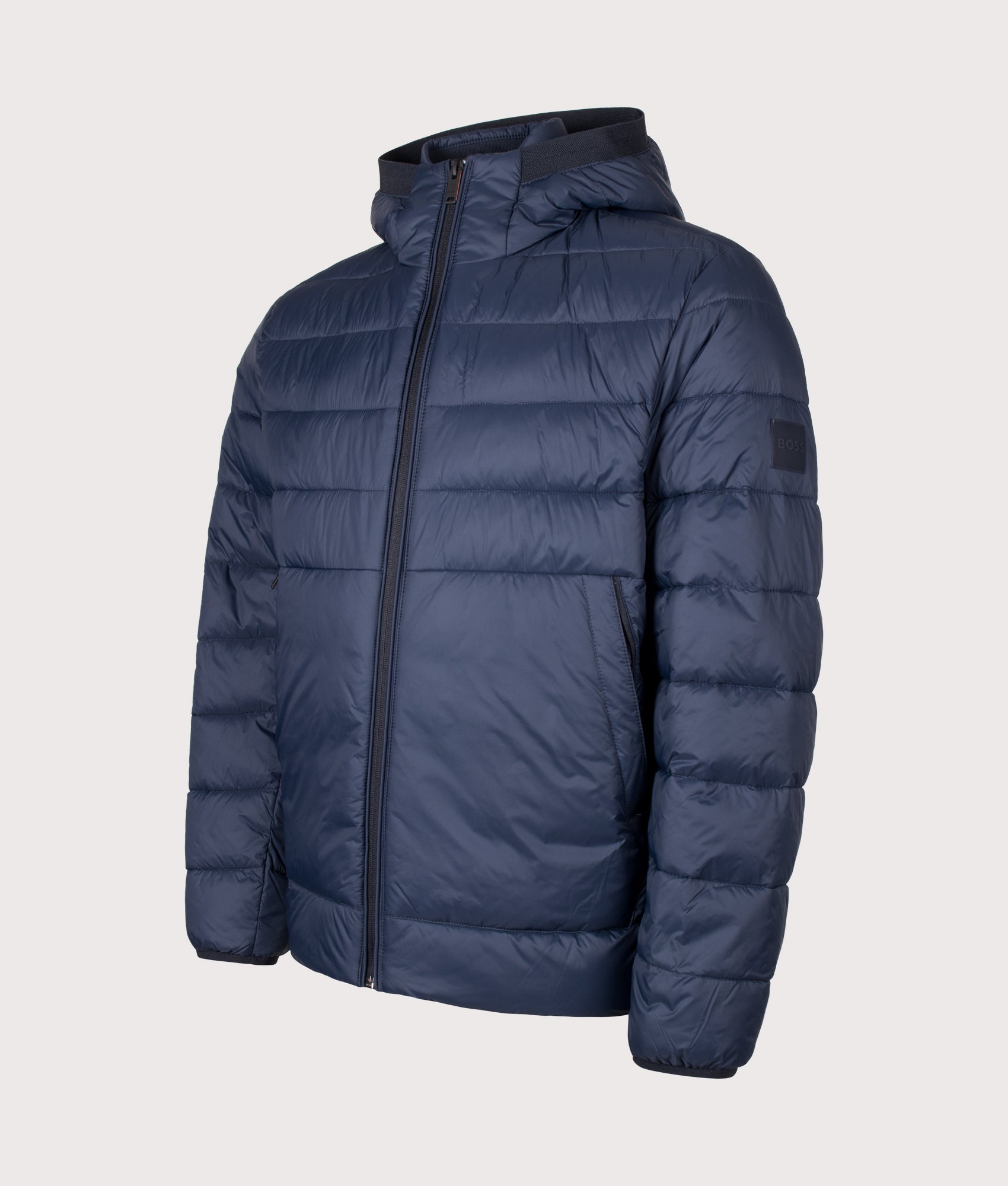 BOSS Regular Fit Odenni Puffer Jacket in Dark Blue at EQVVS Menswear. Front shot.