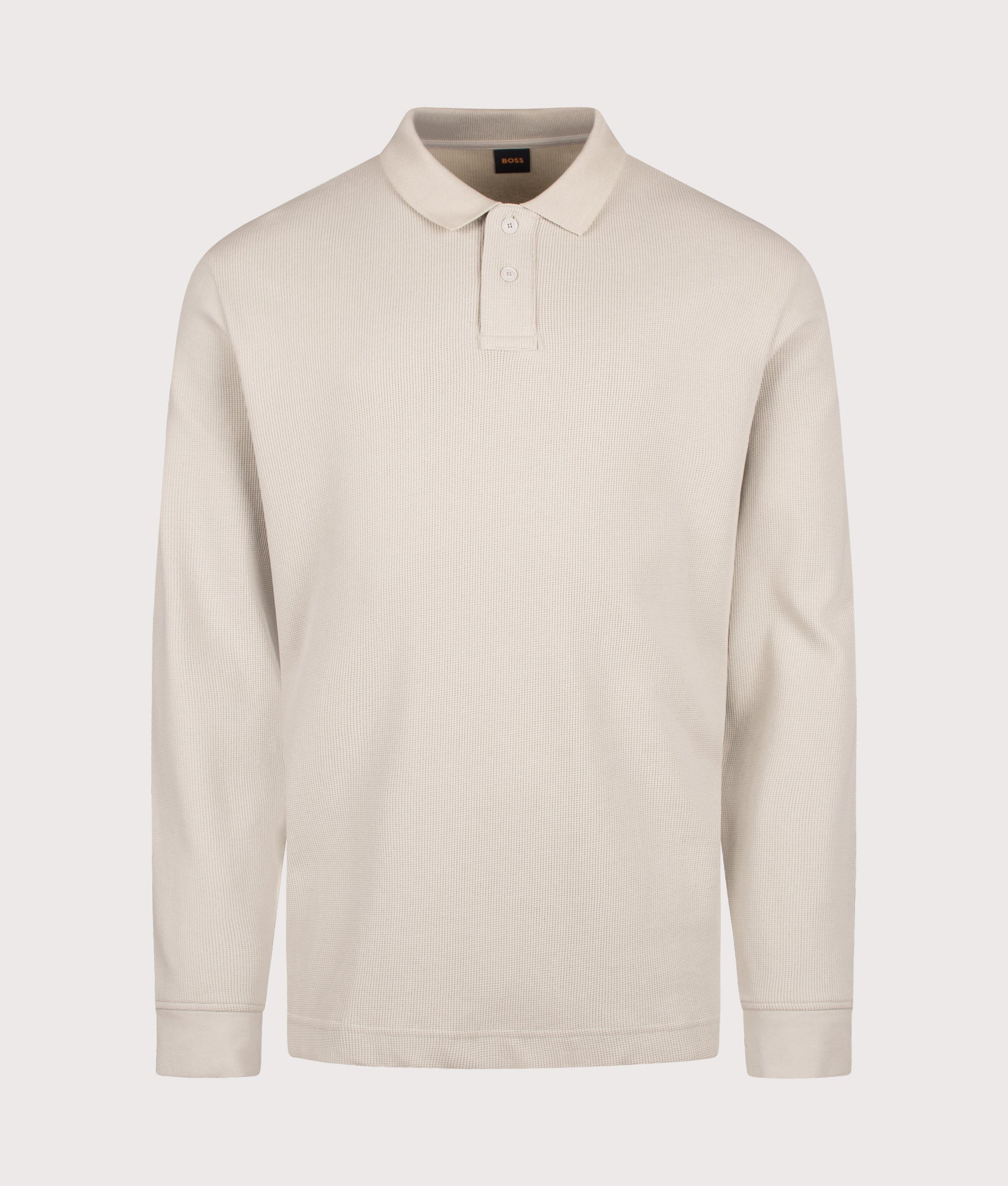 BOSS Regular Fit Petempestolong 1 Long Sleeve Polo Shirt in Light Beige at EQVVS Menswear. Front shot.