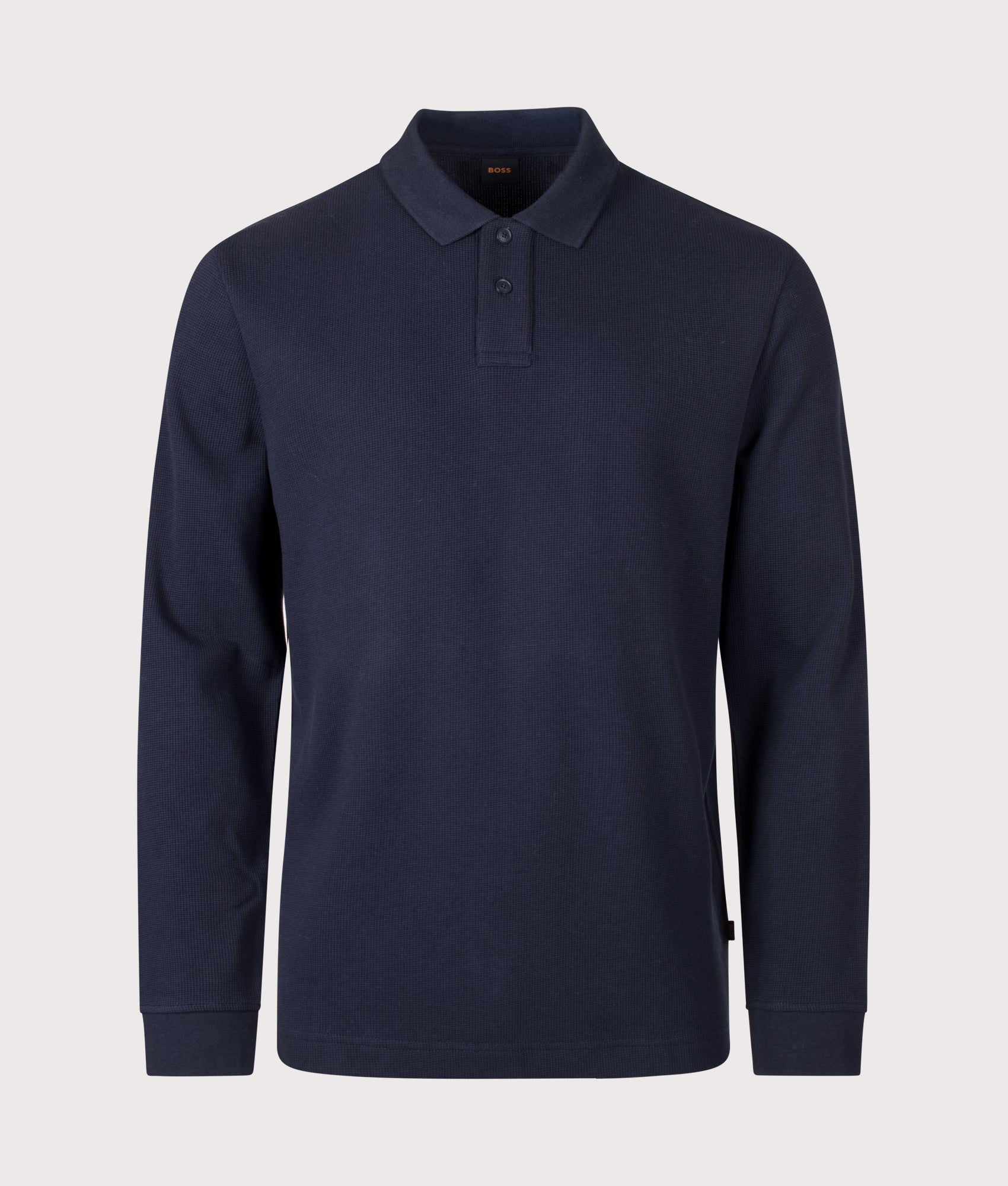 BOSS Regular Fit Petempestolong 1 Long Sleeve Polo Shirt in Dark Blue at EQVVS Menswear. Front shot.