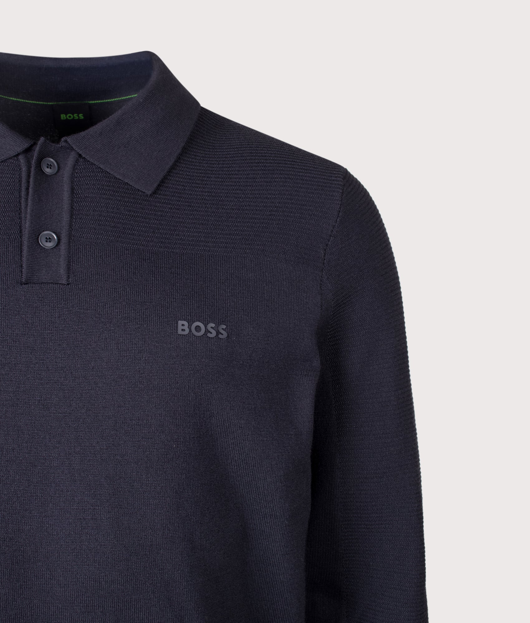 BOSS Regular Fit Long Sleeve Momentum X Knitted Polo Shirt in Dark Blue at EQVVS Menswear. Detail shot.