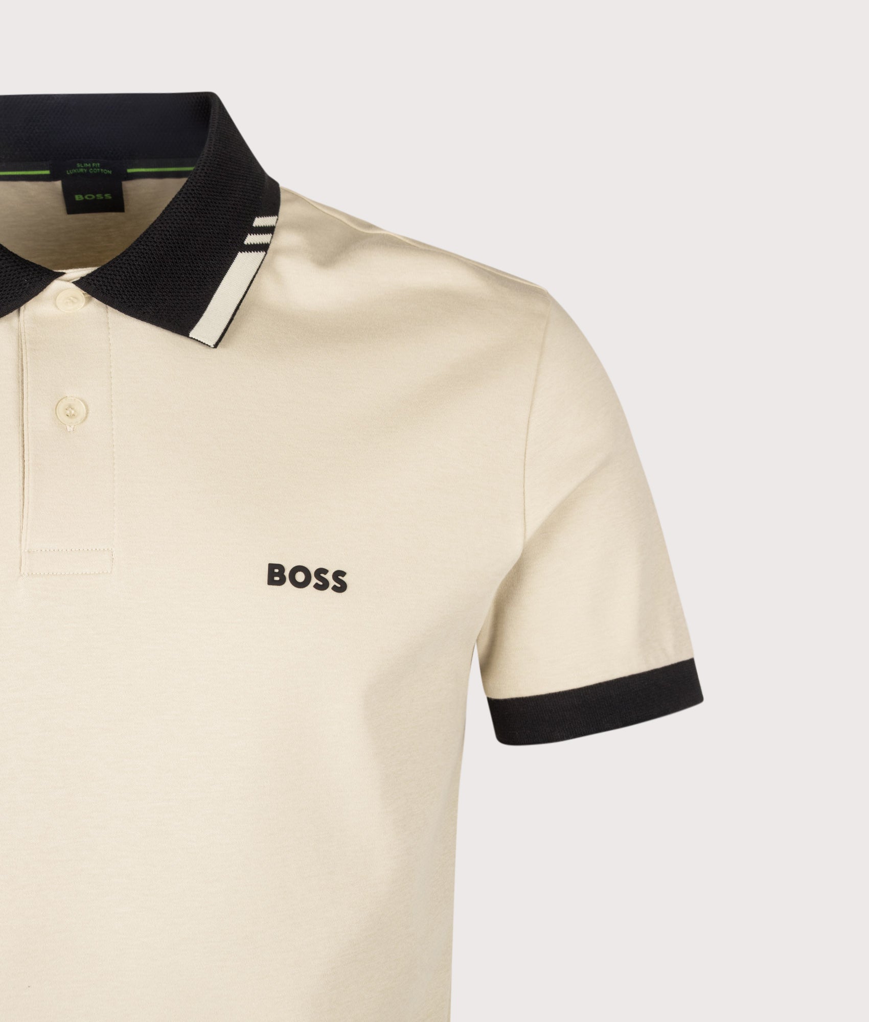 BOSS Slim Fit PL Network Paule Polo Shirt in Light Beige at EQVVS Menswear. Detail shot.