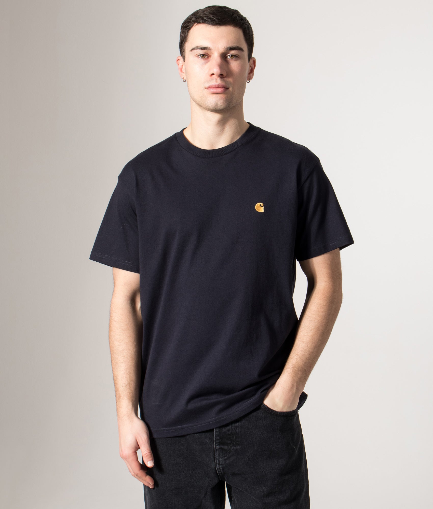 Carhartt WIP Loose Fit Chase T-Shirt in Dark Navy at EQVVS Menswear. Model front shot.