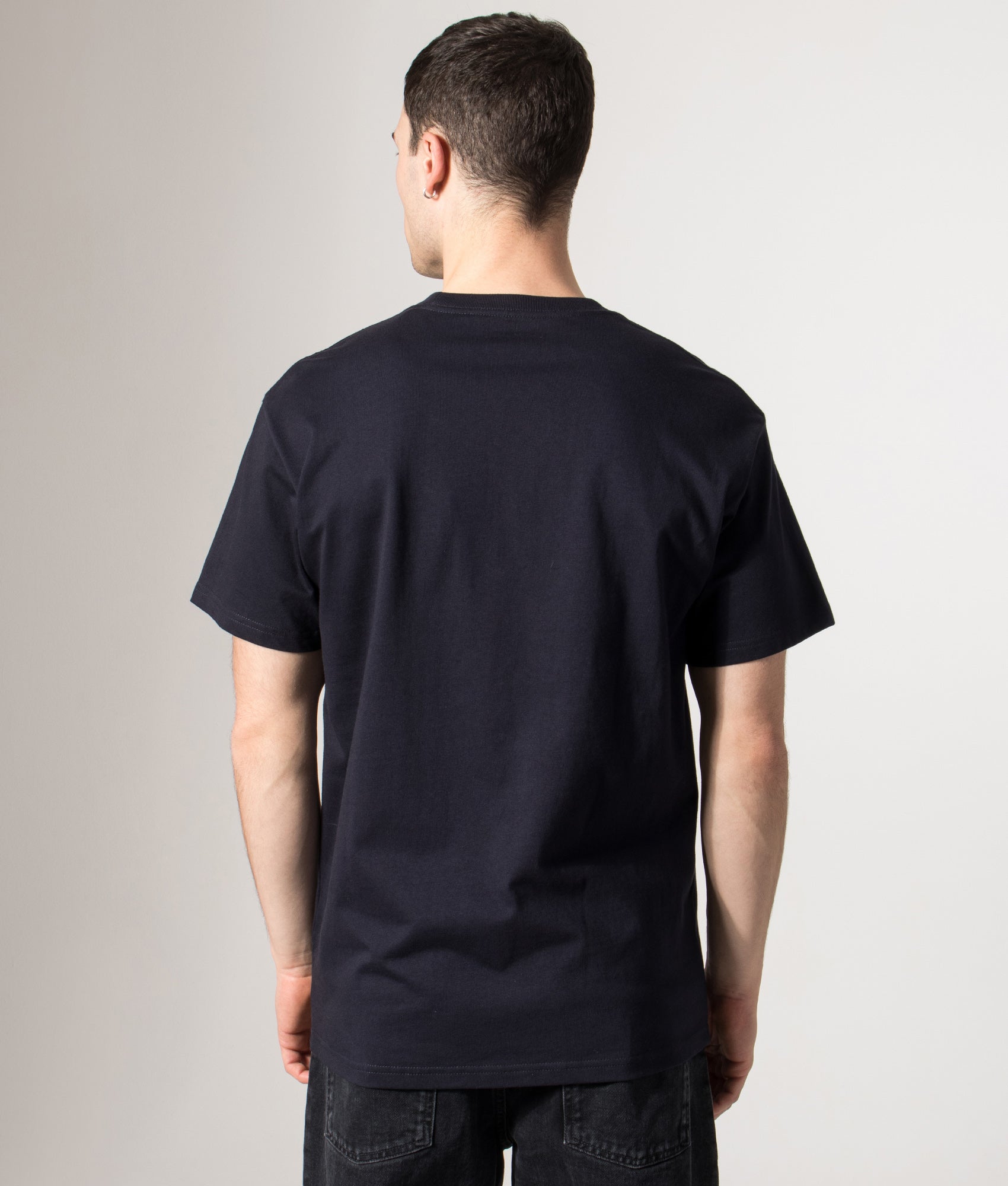 Carhartt WIP Loose Fit Chase T-Shirt in Dark Navy at EQVVS Menswear. Model back shot.