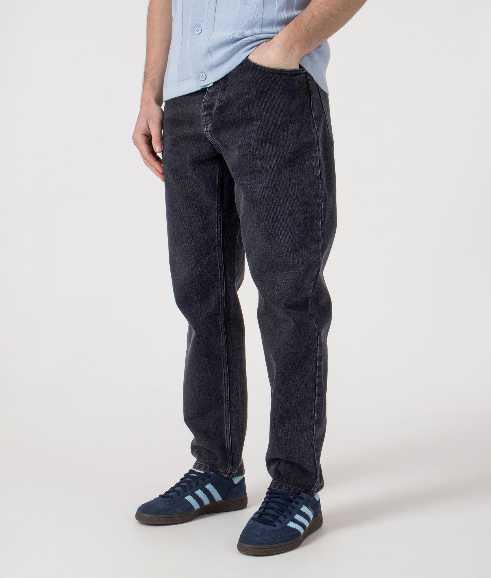 Carhartt WIP Relaxed Fit Newel Jeans in  washed Black at EQVVS Menswear. Angled front shot.