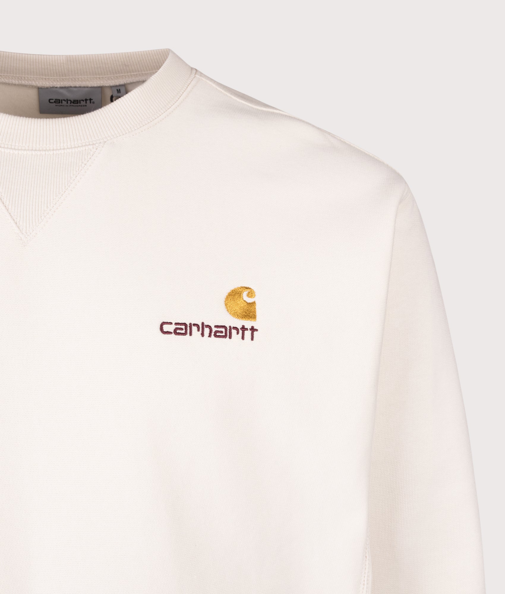 Carhartt WIP staple, the Relaxed Fit American Script Sweatshirt in Natural at EQVVS Menswear. Detail shot.