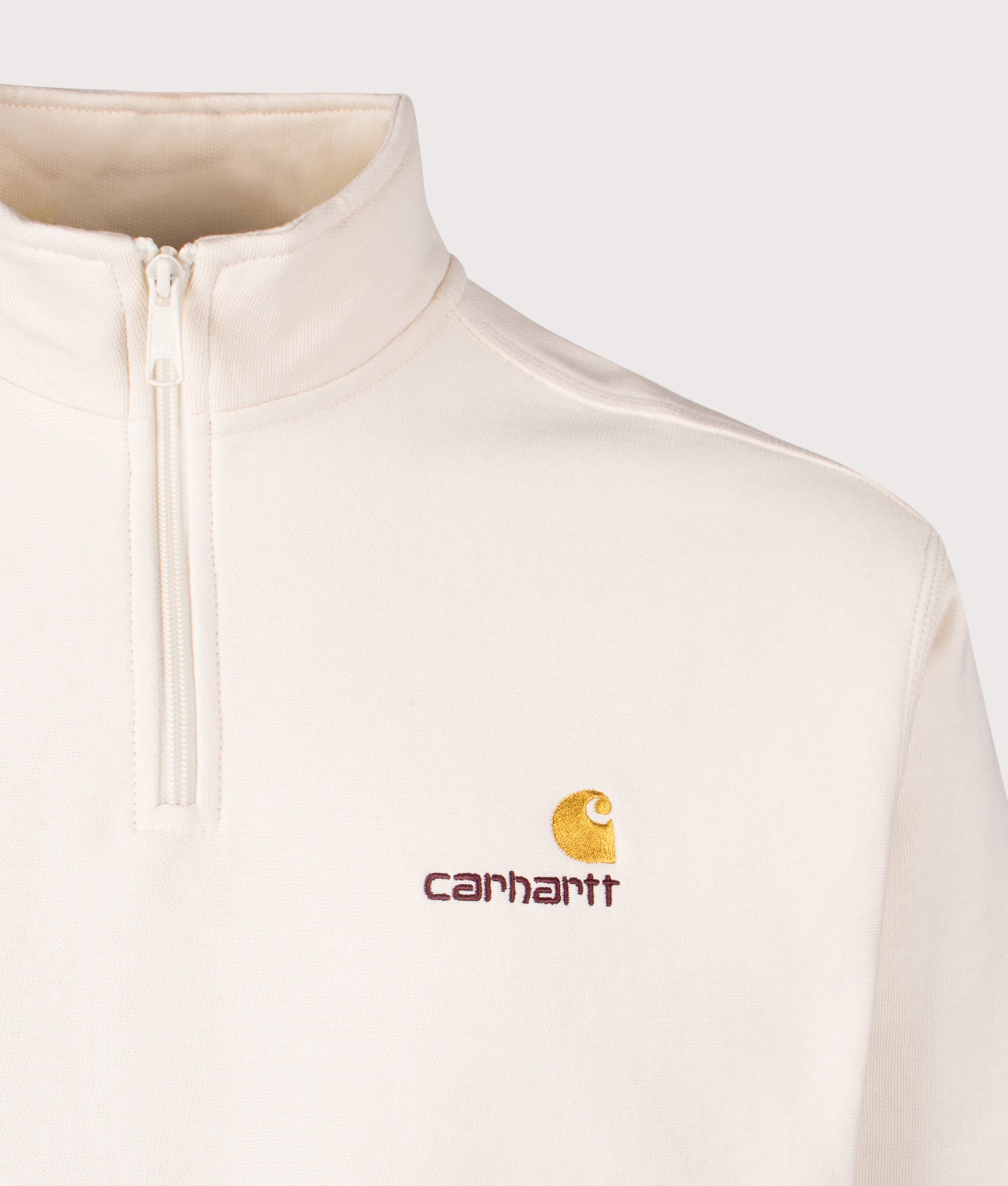 Carhartt WIP Relaxed Fit Quarter Zip American Script Sweatshirt in Natural Beige. EQVVS Detail shot.