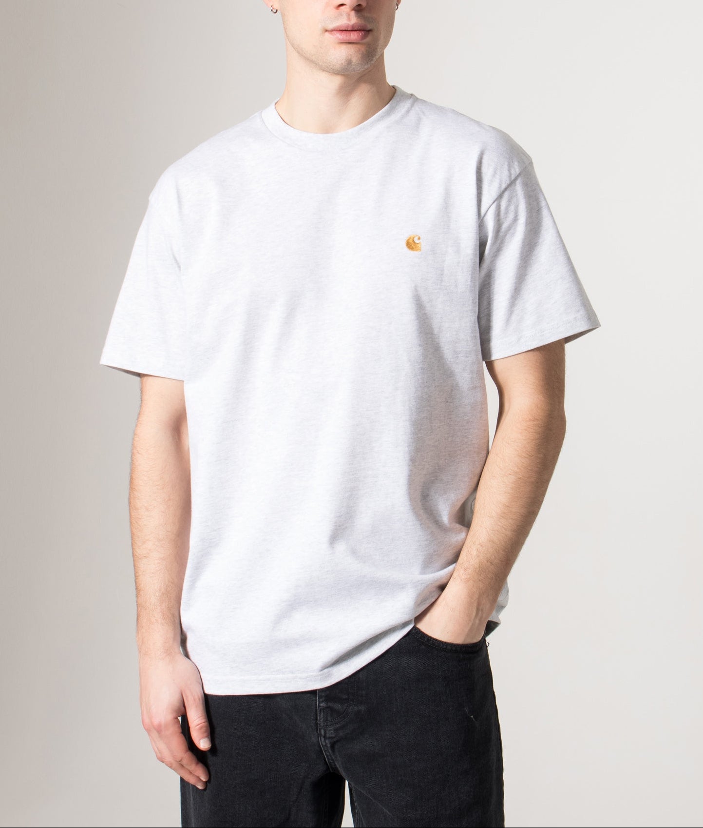 Carhartt WIP Loose Fit Chase T-Shirt in Ash Heather and Gold at EQVVS Menswear. Model front shot.