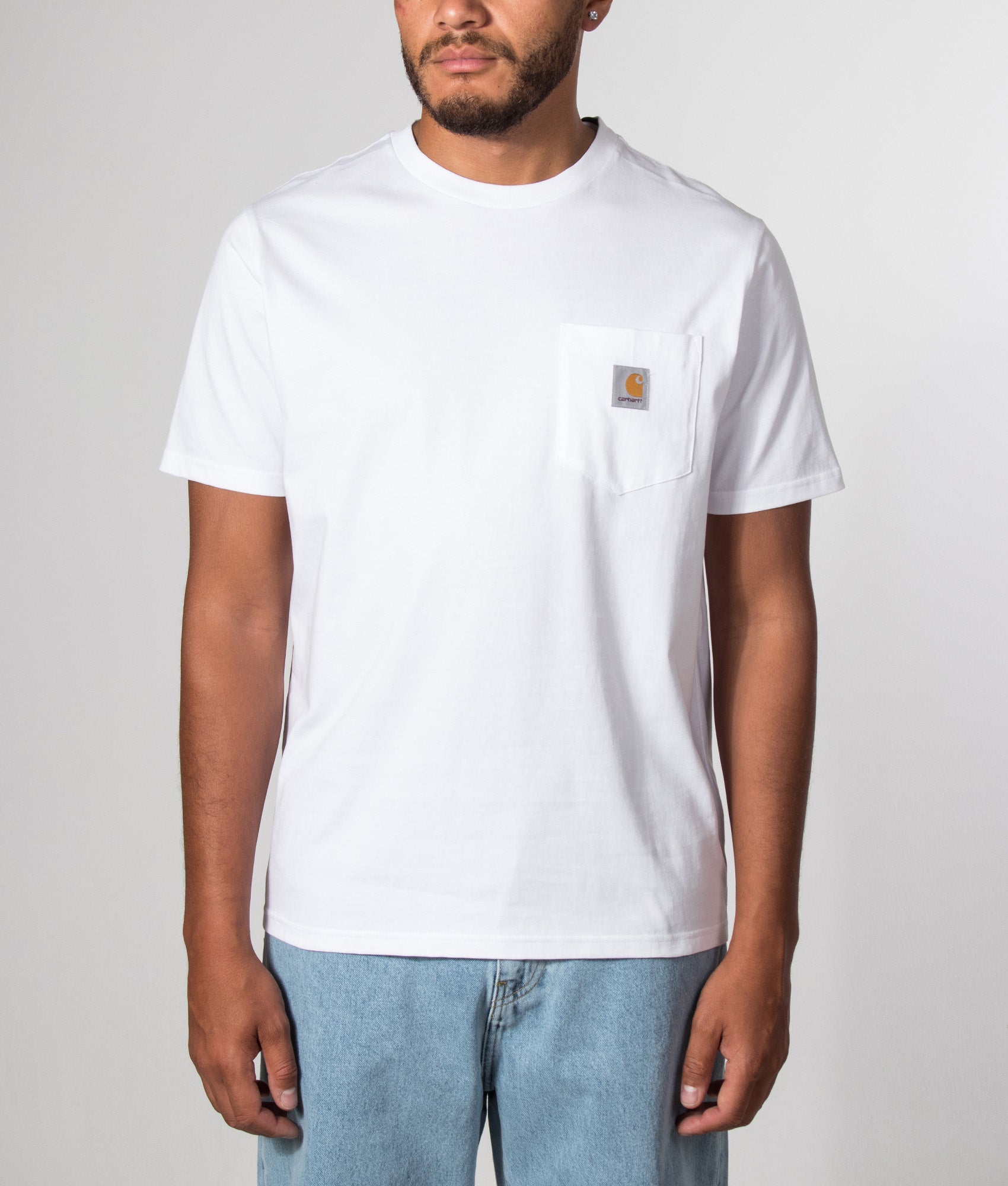 Carhartt WIP Pocket T-Shirt in White at EQVVS Menswear. Model front shot.