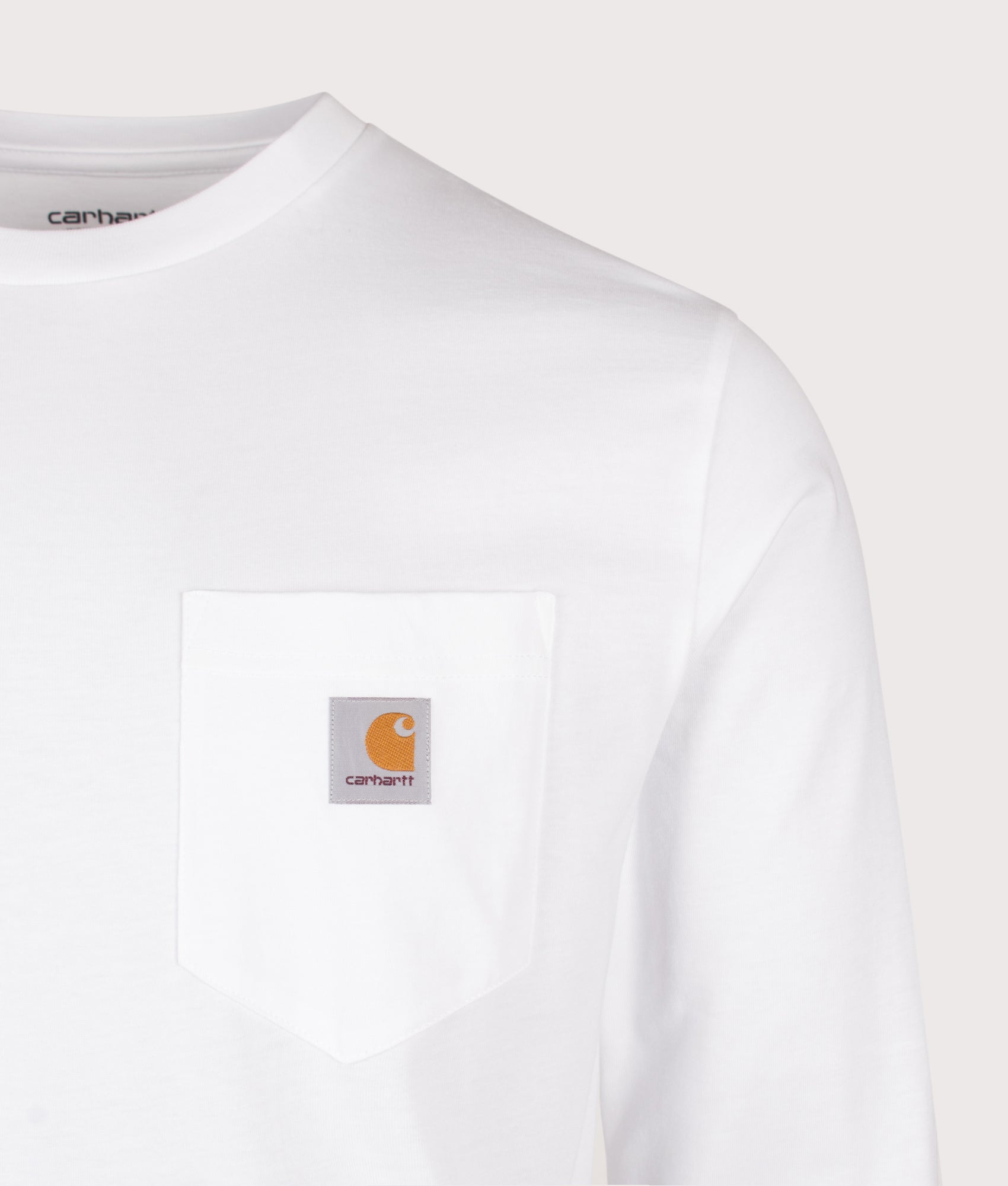 Carhartt WIP Regular Fit Long Sleeve Pocket T-Shirt in White at EQVVS Menswear. Detail shot.