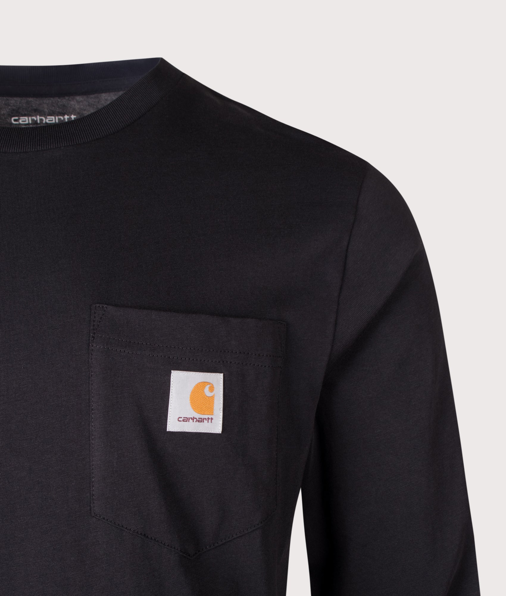 Carhartt WIP Regular Fit Long Sleeve Pocket T-Shirt in Black at EQVVS Menswear. Detail shot.
