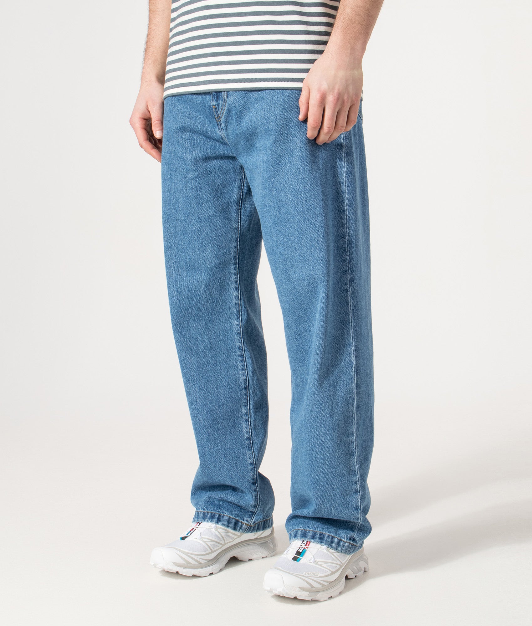 Carhartt WIP Relaxed Fit Landon Jeans in Blue at EQVVS Menswear. Angled model front shot.